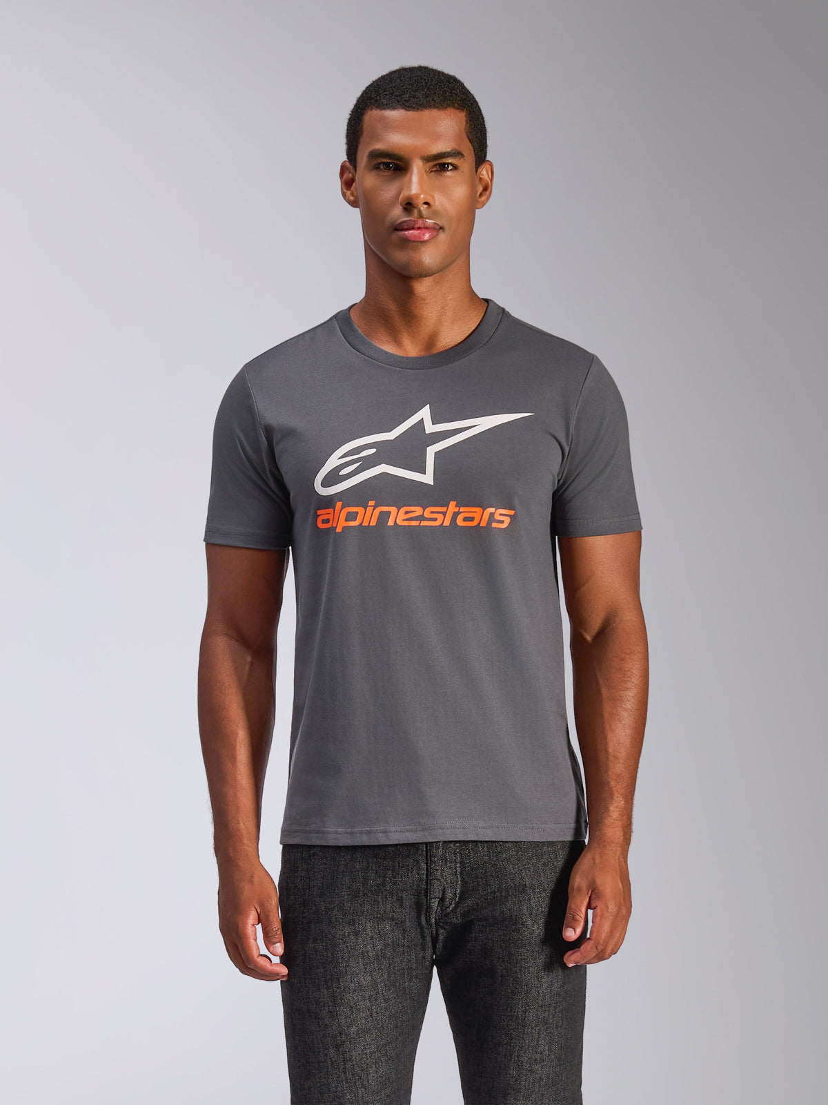Alpinestars Always 2.0 CSF Tee, Short Sleeve T-Shirt, Charcoal Grey, Large White A-star Logo with Orange Alpinestars Wordmark, Worn by a man, Casual Motorsport Streetwear