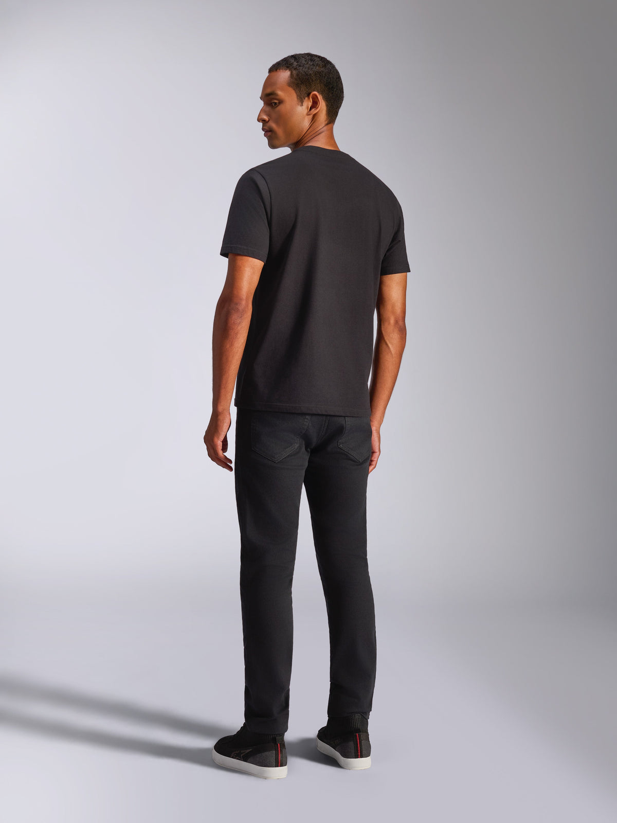 Alpinestars Blaze 2.0 CSF Tee, Short Sleeve T-Shirt, Black, back view on male model, worn with black pants, casual motorsport streetwear