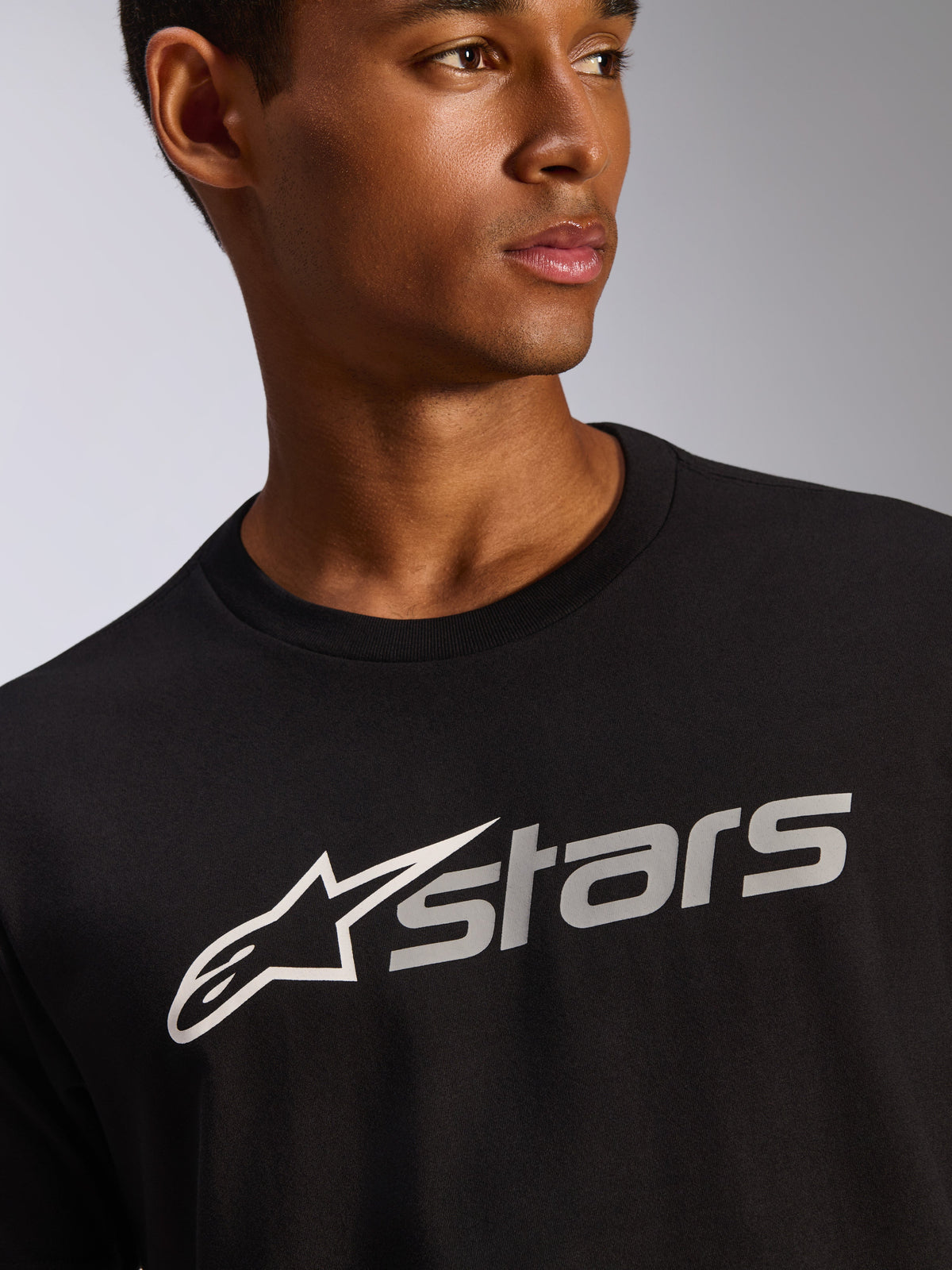 Alpinestars Blaze 2.0 CSF Tee, Short Sleeve T-Shirt, Black, White and Grey Astars Logo Graphic, Casual Motorsport Streetwear, Close-Up View on Model