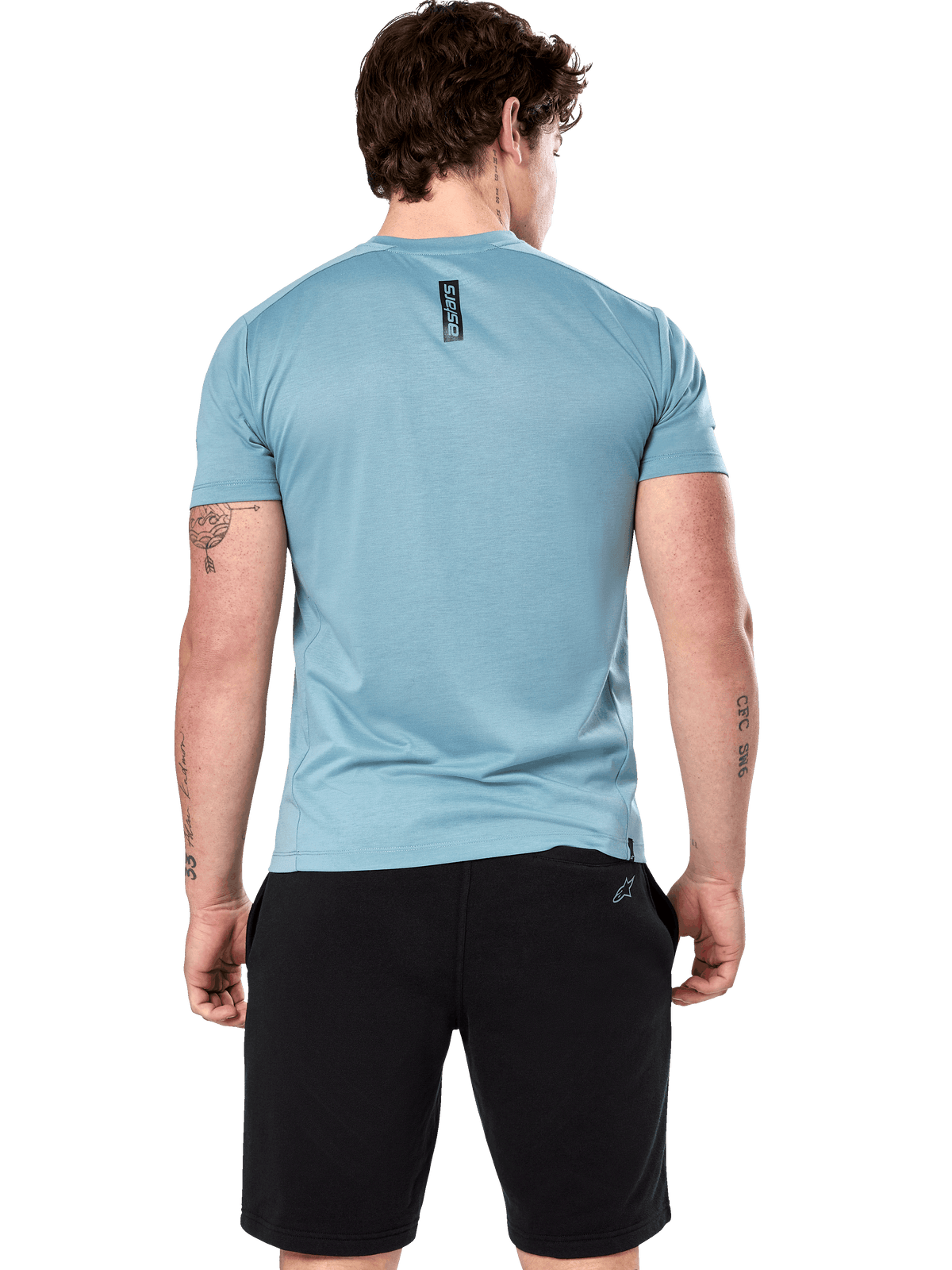 Alpinestars Point Performance Tee, Short Sleeve T-Shirt, Ice Blue, back view on model showing vertical black astars word print, paired with black shorts, casual performance sportswear