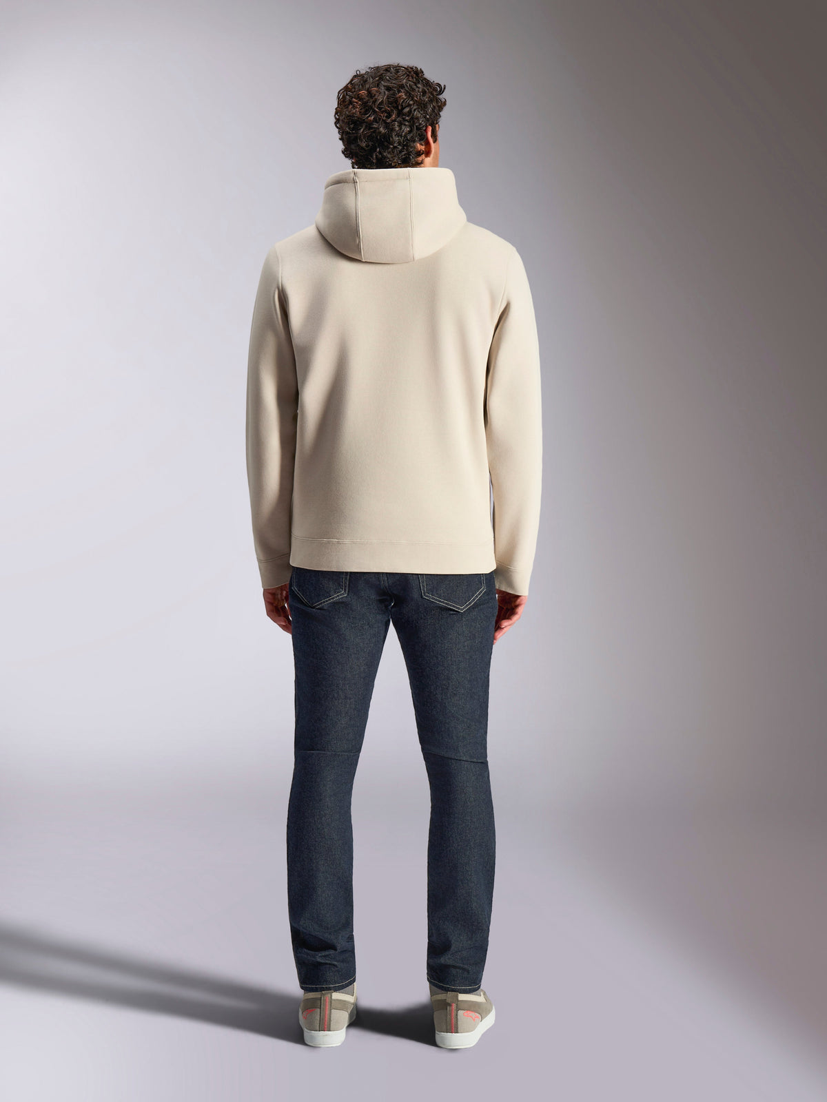 Alpinestars Pulse Hoodie, casual streetwear, Off White, back view on model wearing dark denim jeans and sneakers, hooded pullover fleece with ribbed cuffs and hem