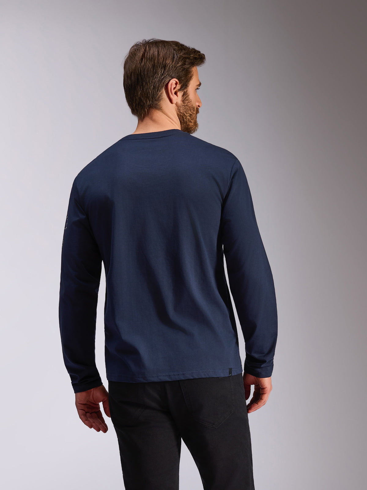 Alpinestars Mandatory CSF Tee, Long Sleeve, Navy blue, back view of a man wearing a casual crewneck long sleeve t-shirt, featuring a logo on the sleeve, motorsport-inspired sportswear