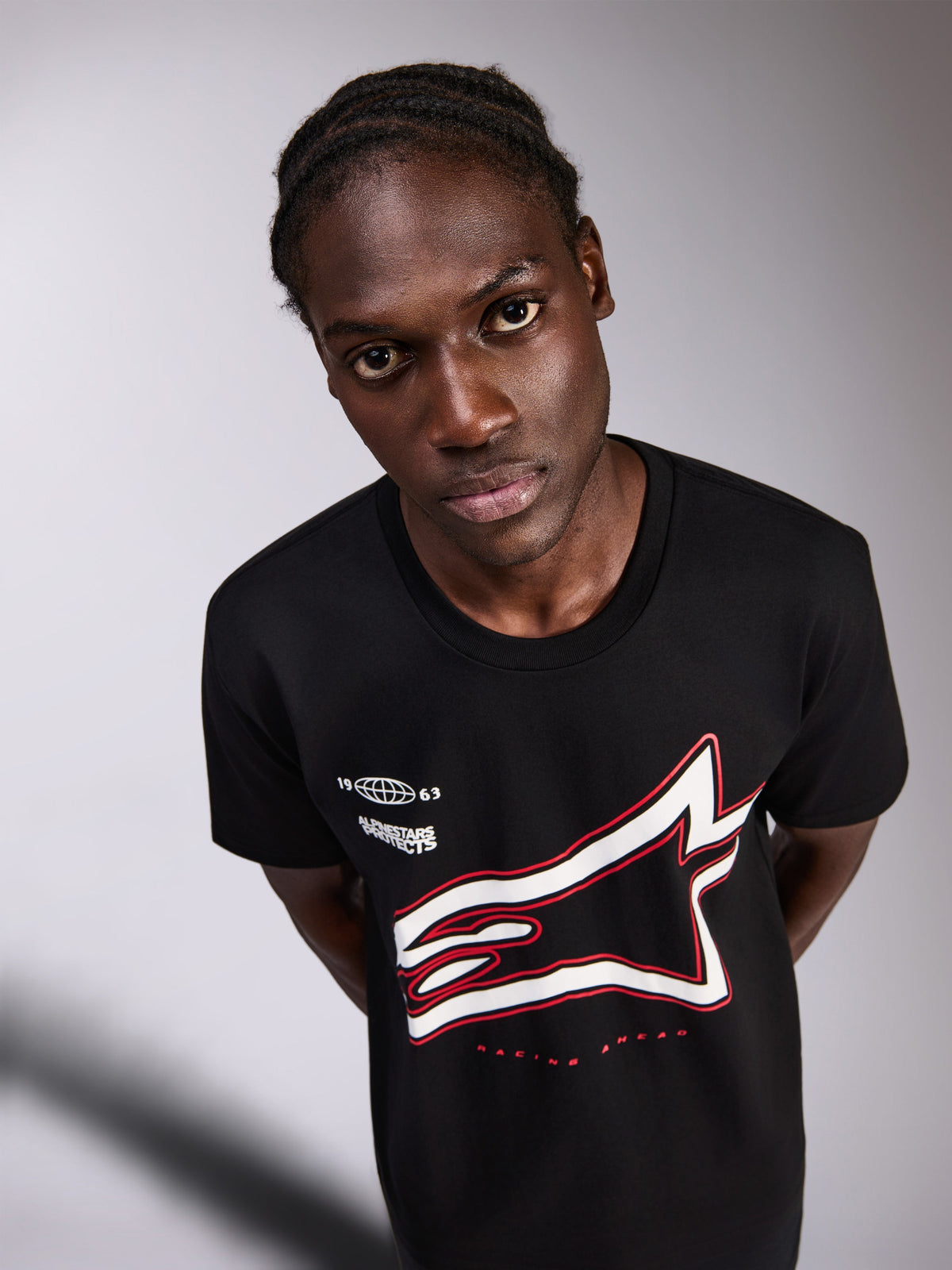 Alpinestars Authority CSF Tee, Short Sleeve T-Shirt, Black, featuring a large cropped white Astars logo with red outline and small chest graphics, casual motorsport-inspired streetwear