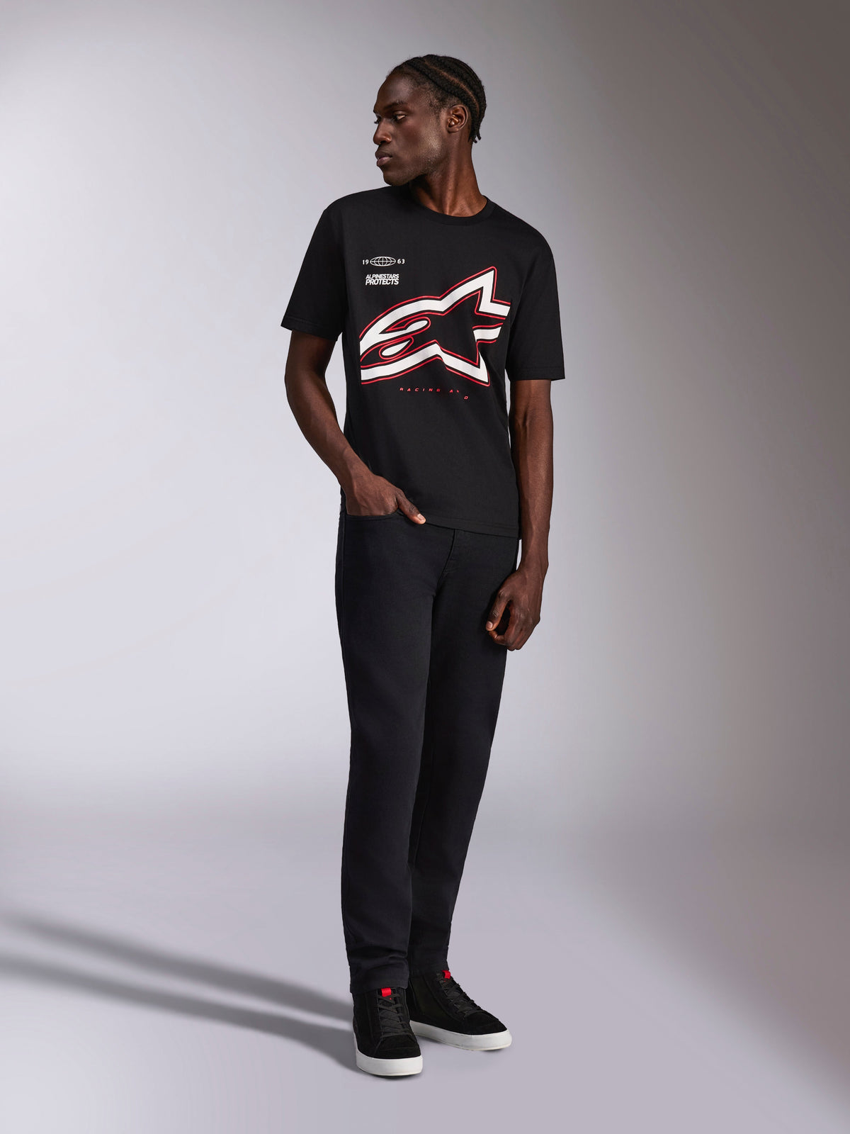 Alpinestars Authority CSF Tee, Short Sleeve T-Shirt, Black, large red and white cropped Astars outline logo, worn by a model with black pants and sneakers, casual motorsport streetwear