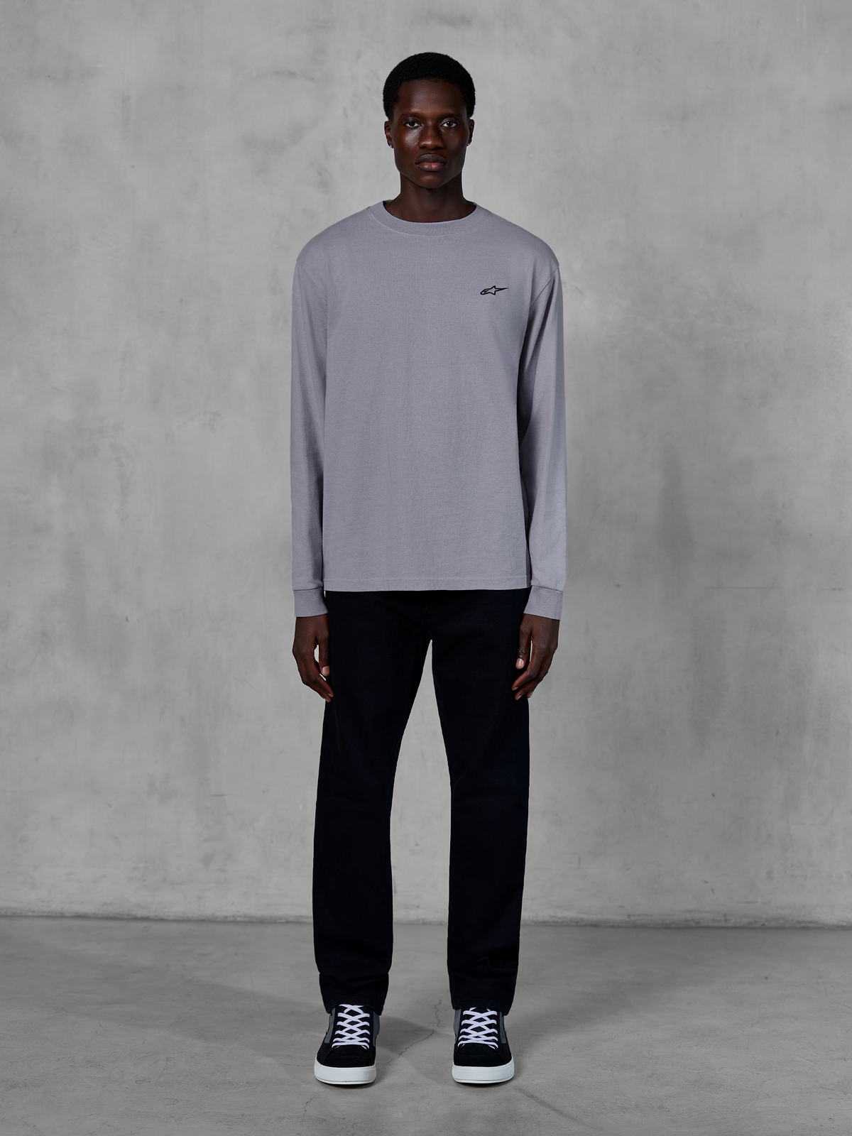 Alpinestars Essentials Ageless LS Tee, Long Sleeve T-Shirt, Silver, small black Alpinestars logo on the chest, organic cotton jersey with stone wash finish, worn by a model with black pants and sneakers, casual streetwear