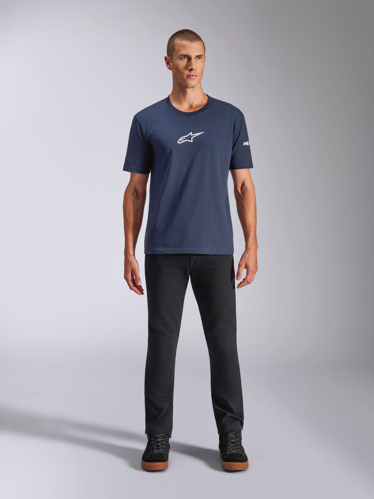 Alpinestars Frontal CSF Tee, Short Sleeve T-Shirt, Navy Blue, white Alpinestars star logo on chest, worn with black pants and sneakers, casual performance sportswear