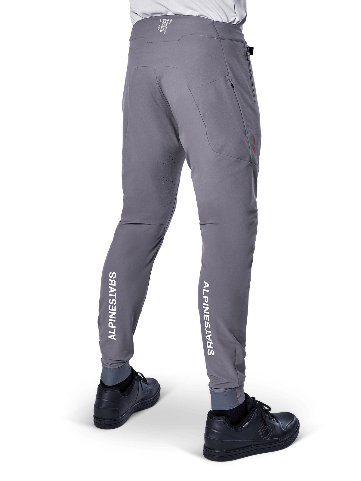 Alpinestars A-Aria Elite Pants, MTB Pants, Dark Gray, featuring vertical white Alpinestars logos on the back of the lower legs, laser-cut ventilation holes, elasticated cuffs, and a performance fit for mountain biking