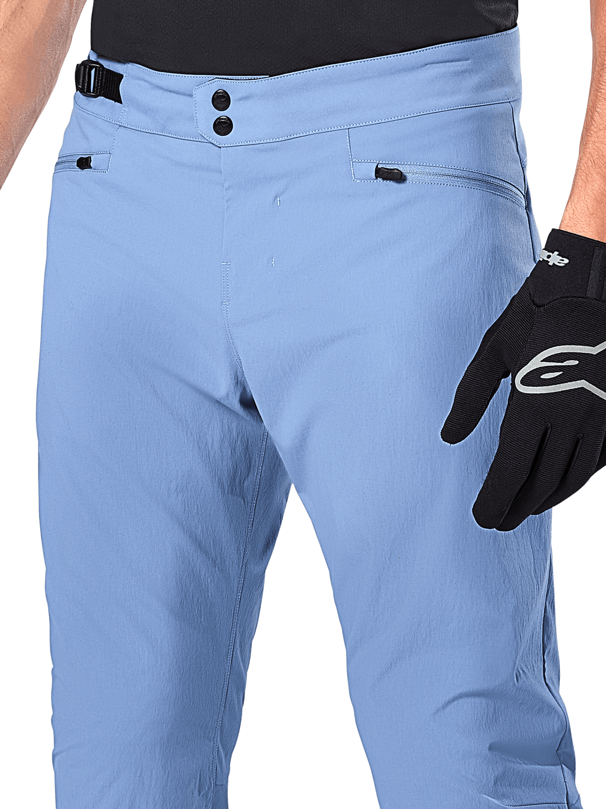 Alpinestars A-Dura Pants, MTB Cycling Pants, Infinity Blue, close-up of waist featuring double snap closure and side cinch adjuster, zippered pockets, worn with black Alpinestars gloves