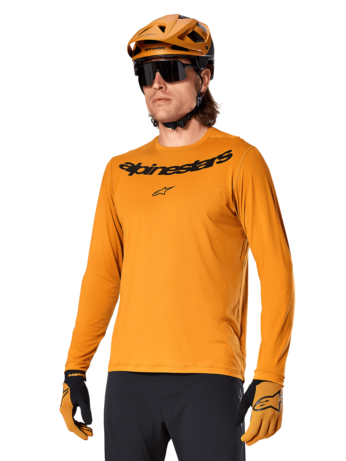 Alpinestars A-Dura Rocker Long Sleeve Jersey, MTB Mountain Biking Jersey, Dark Gold, person wearing jersey with matching helmet and gloves, sporty coordinated look with Alpinestars wordmark on chest