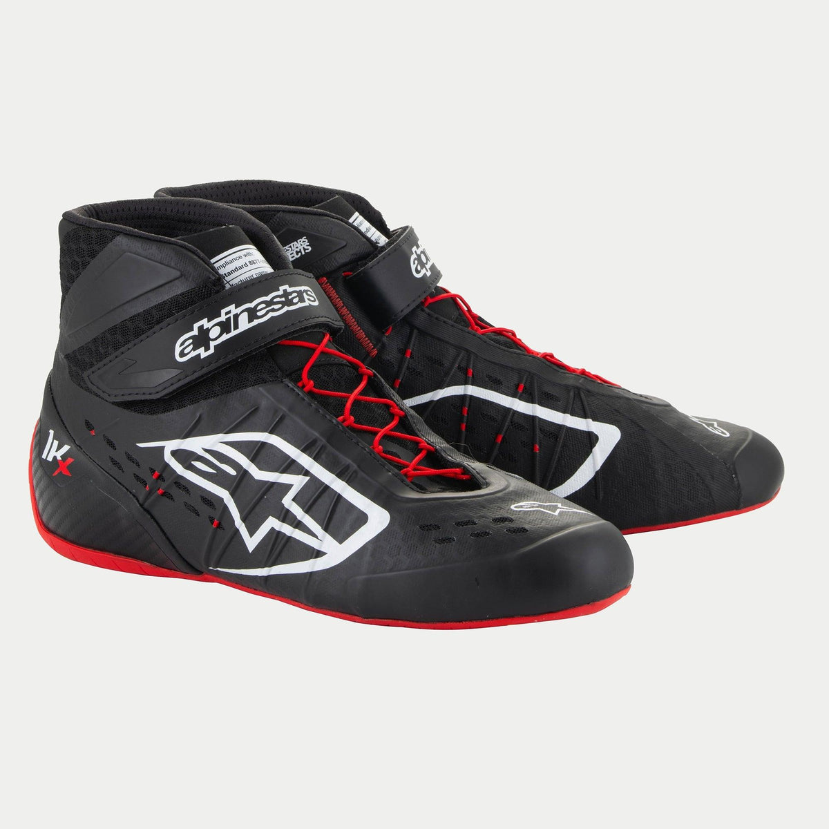 Alpinestars Tech-1 KX V3 Shoes, Karting Shoes, Black White and Red, featuring white Alpinestars logos, red asymmetric laces, and a red outer sole, sleek thermo-welded construction with laser-cut perforations and adjustable ankle straps for motorsport performance.