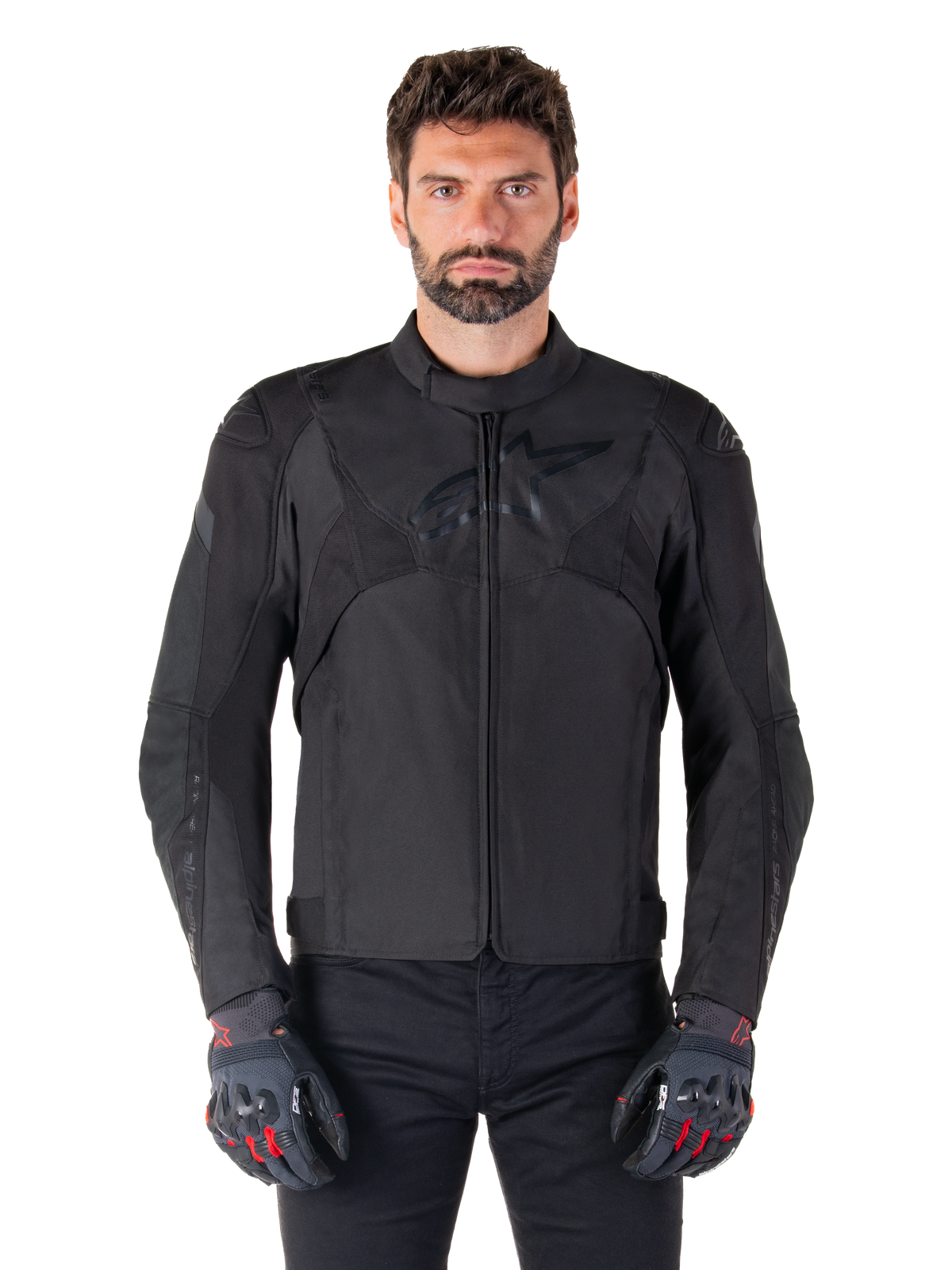 Alpinestars T-Jaws V4 Waterproof Jacket, Black Motorcycle Sport Jacket, worn by a man with black gloves featuring red accents, reinforced shoulders and arms, sleek design with subtle chest logo, textile all-weather riding gear