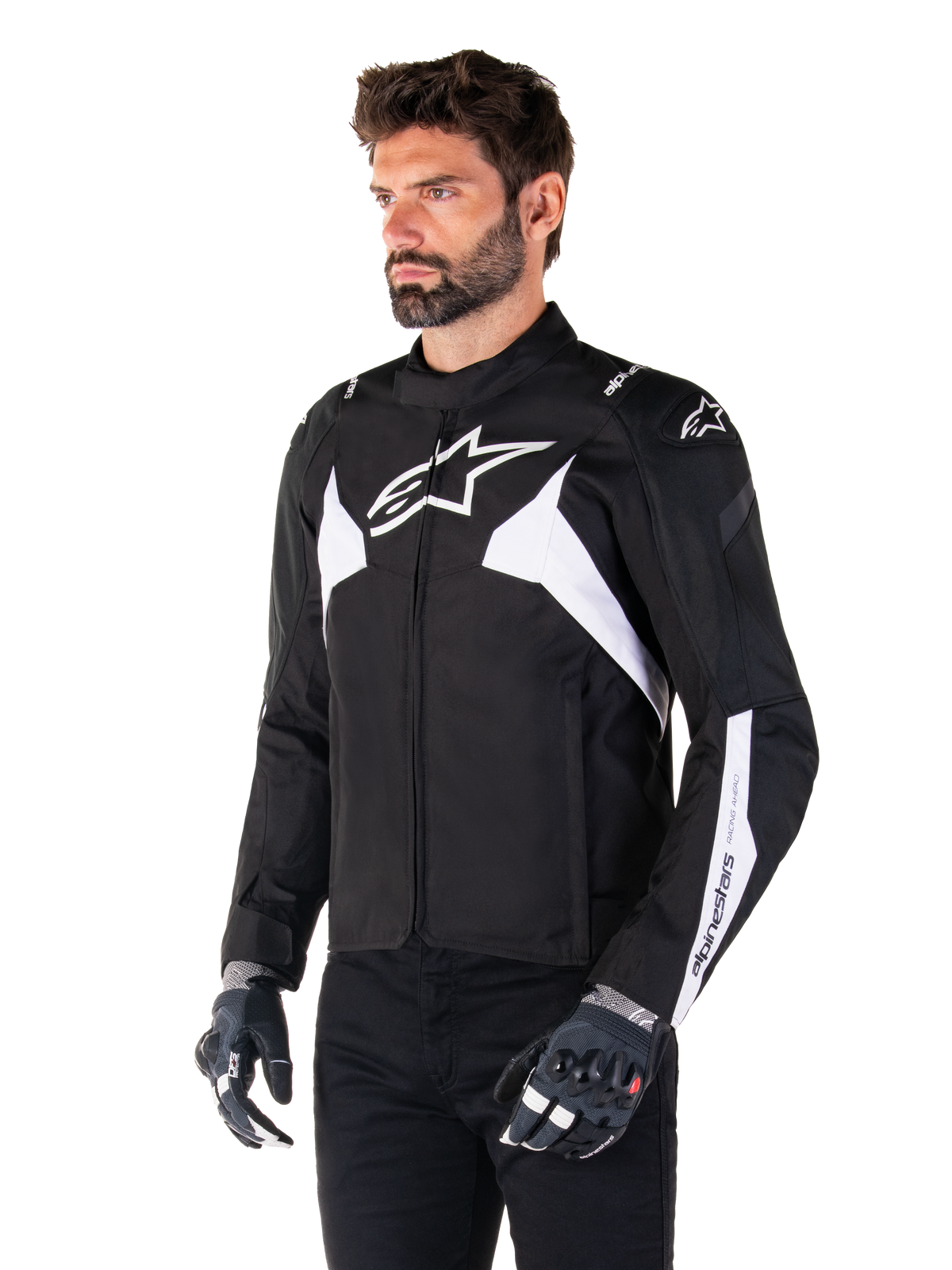 Alpinestars T-Jaws V4 Waterproof Jacket, Black and White, worn by a model with motorcycle gloves, featuring prominent white Alpinestars logos and accents, sport-fit textile motorcycle jacket for road riding