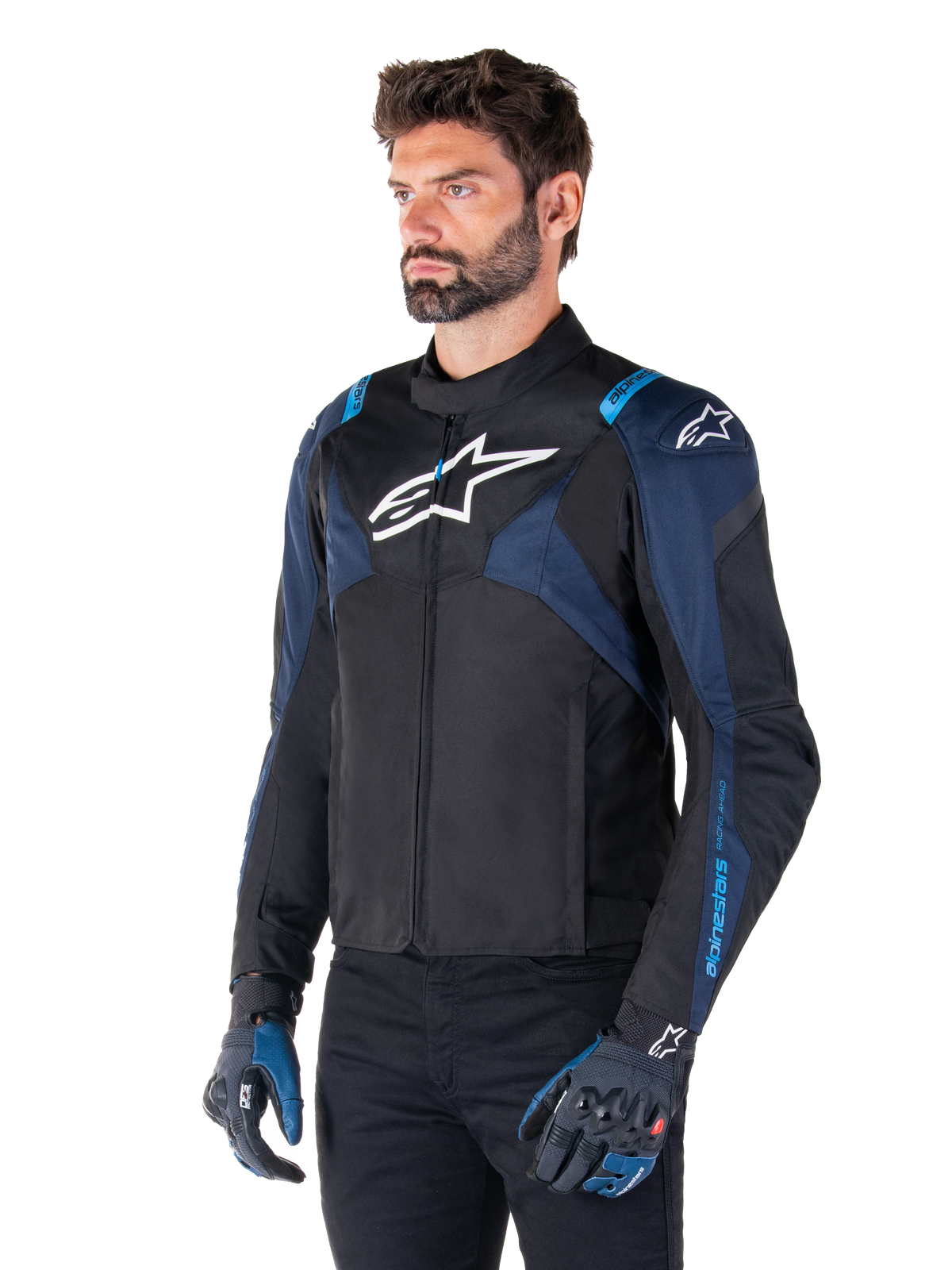 Alpinestars T-Jaws V4 Waterproof Jacket, Motorcycle Jacket, Black Dark Blue and Blithe Blue, worn by a model with matching gloves and black pants, featuring white Alpinestars logos on the chest and shoulders with blue accents on the sleeves, sporty textile riding gear