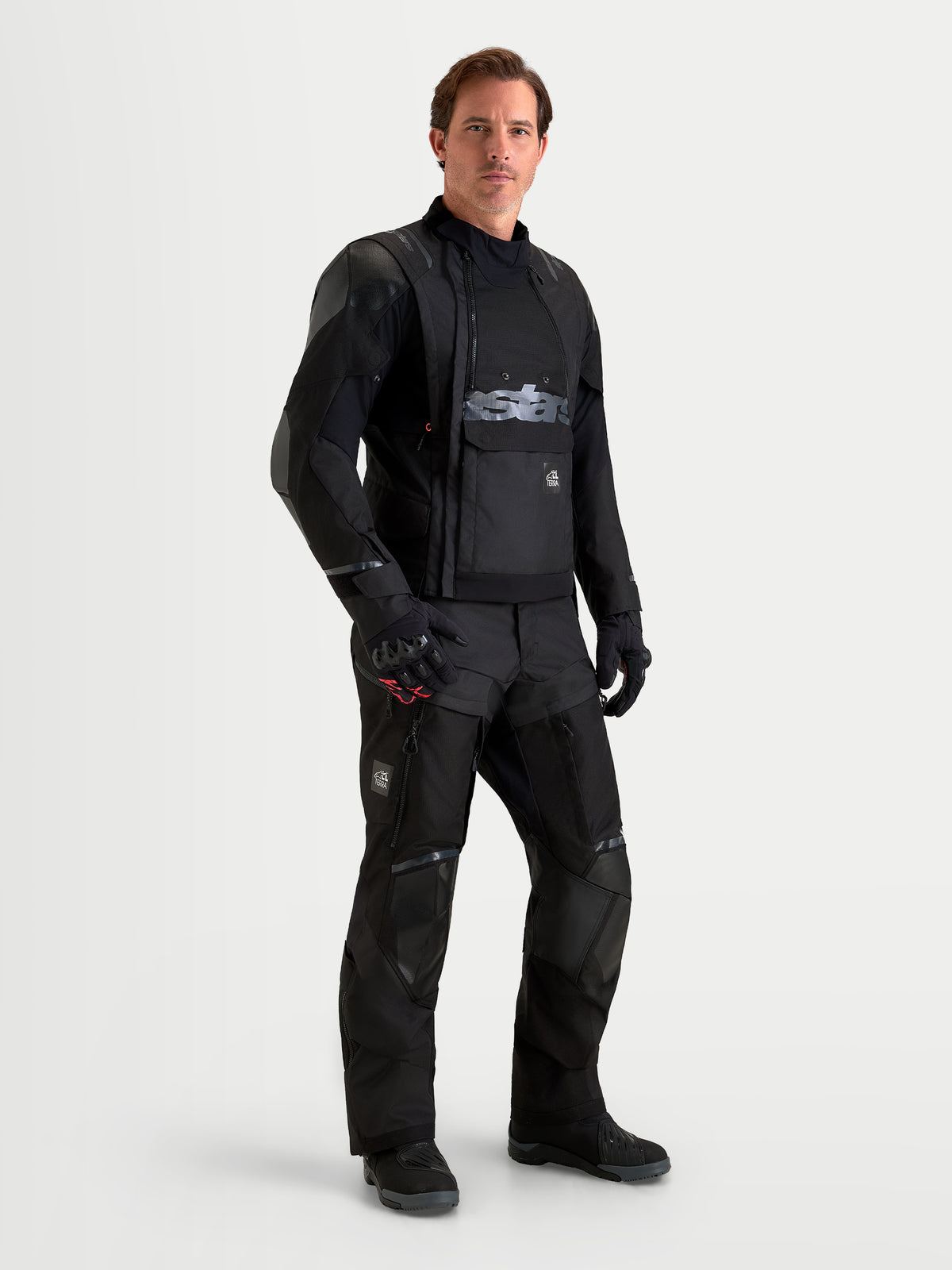 Alpinestars Harok V2 Drystar Gear Set, adventure touring motorcycle jacket and pants, black, worn by a male model showing waterproof textile construction and protective gear