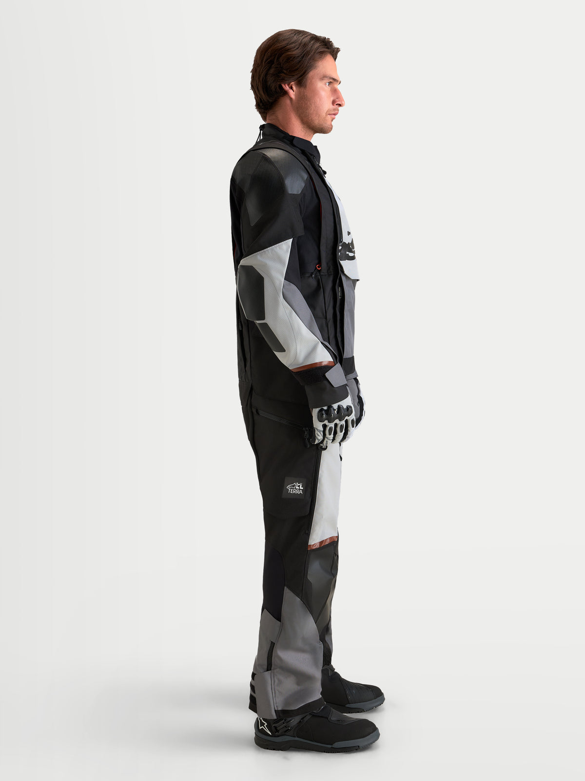 Alpinestars Harok V2 Drystar Jacket, Men's All-Terrain Adventure Motorcycle Textile Jacket in Dark Gray, Ice Gray, and Black, shown from the side worn by a model