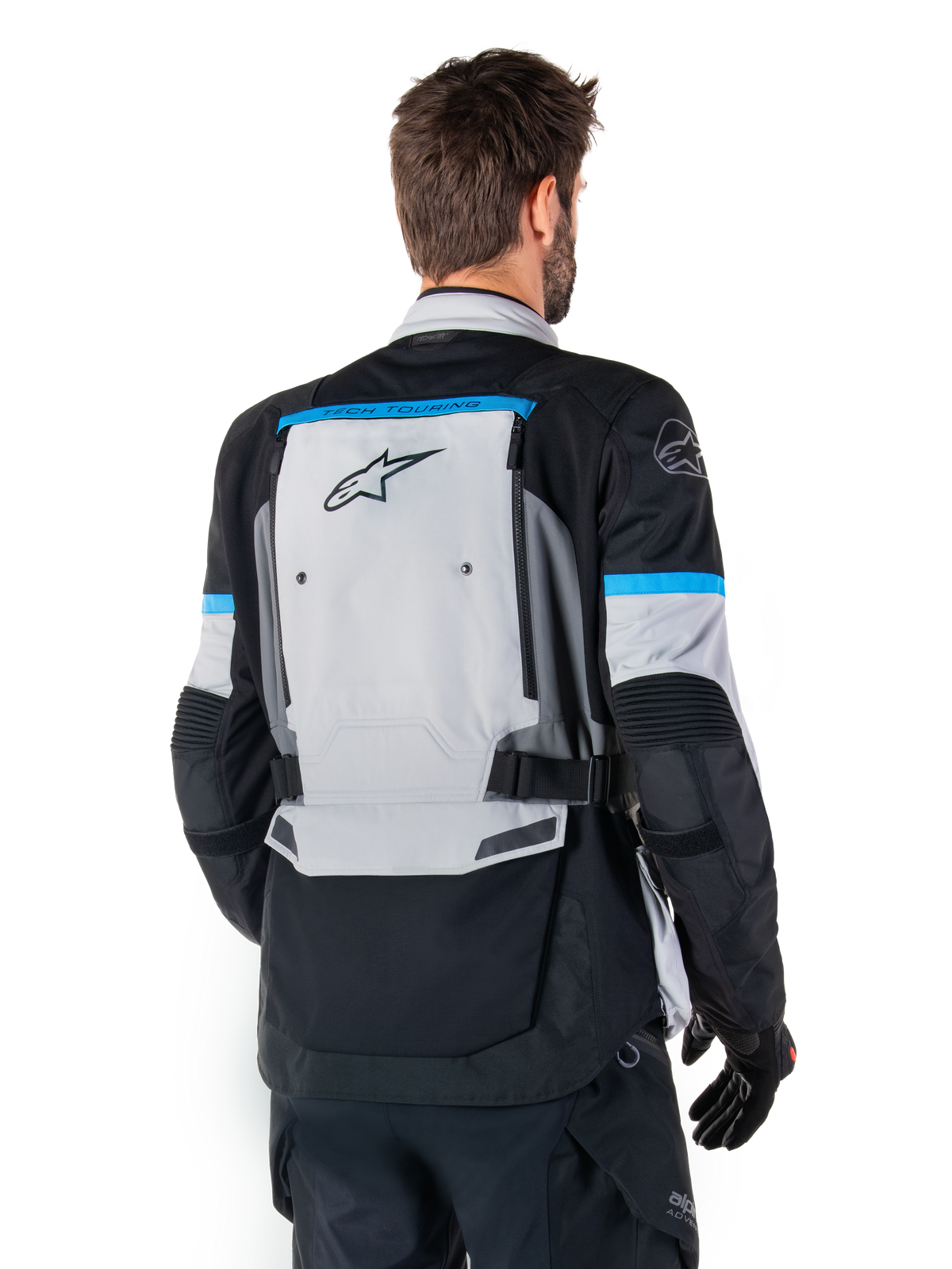 Alpinestars Bogota' Pro Drystar® Jacket, Adventure Motorcycle Jacket, Ice Gray Black and Cyan, back view highlighting the large gray rear panel with Tech Touring branding, cyan accents on sleeves, and durable textile construction.