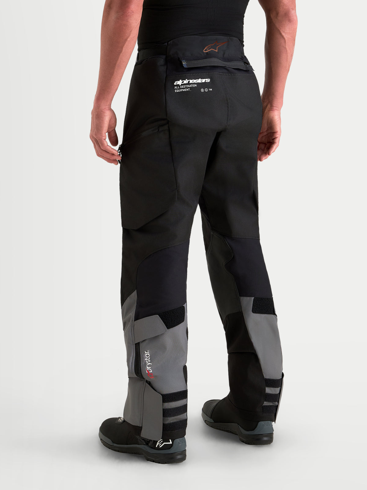 Alpinestars Harok V2 Drystar Pants, Men's adventure motorcycle pants in dark gray and black, featuring ripstop construction, waterproof Drystar membrane, and over-the-boot design, rear view