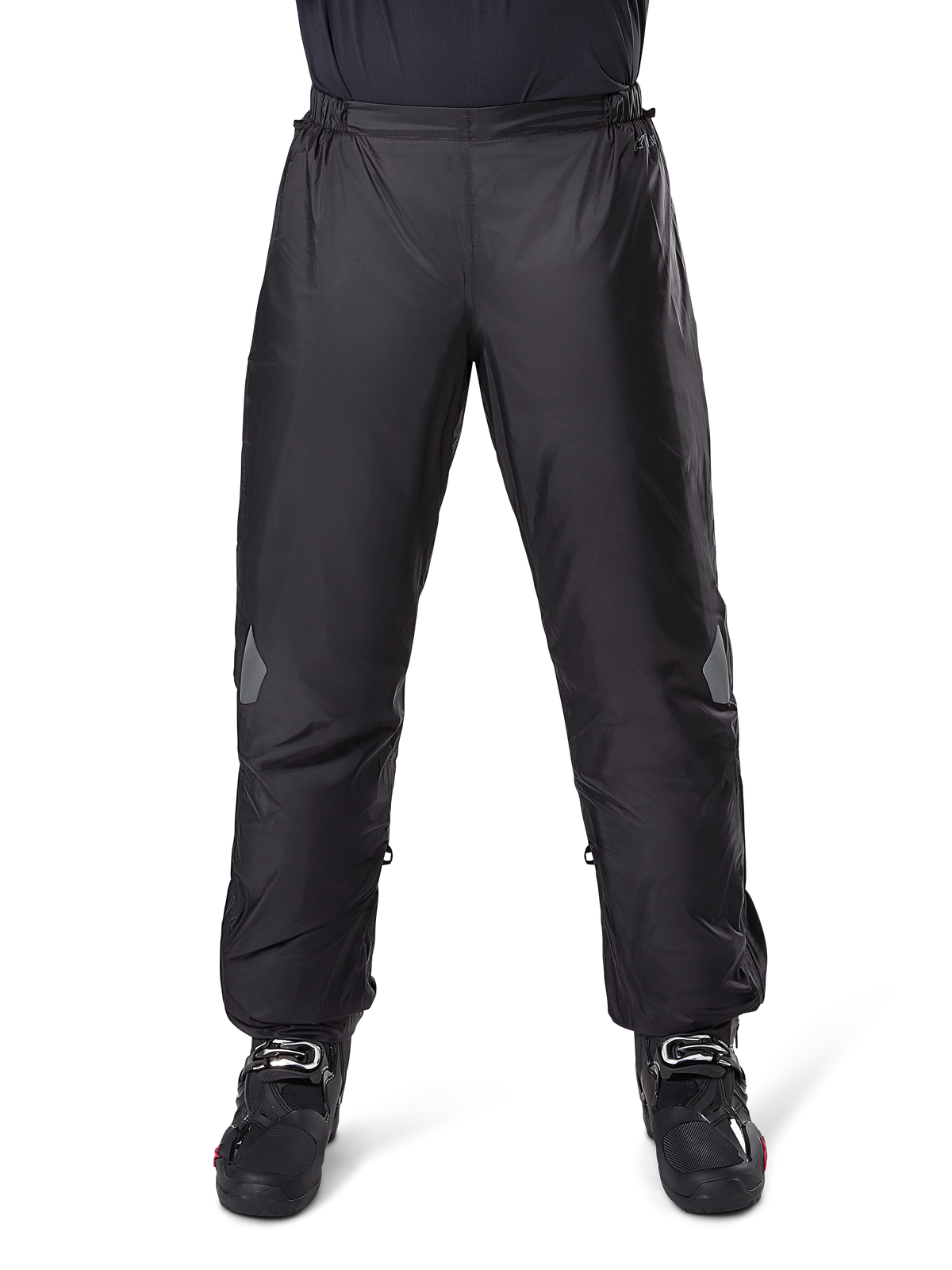 Alpinestars Bogota Pro Drystar 3 Seasons Pants, Waterproof Motorcycle Pants, Black, lightweight technical fabric with reflective knee patches, worn as over-pants with black riding boots, designed for adventure touring weather protection