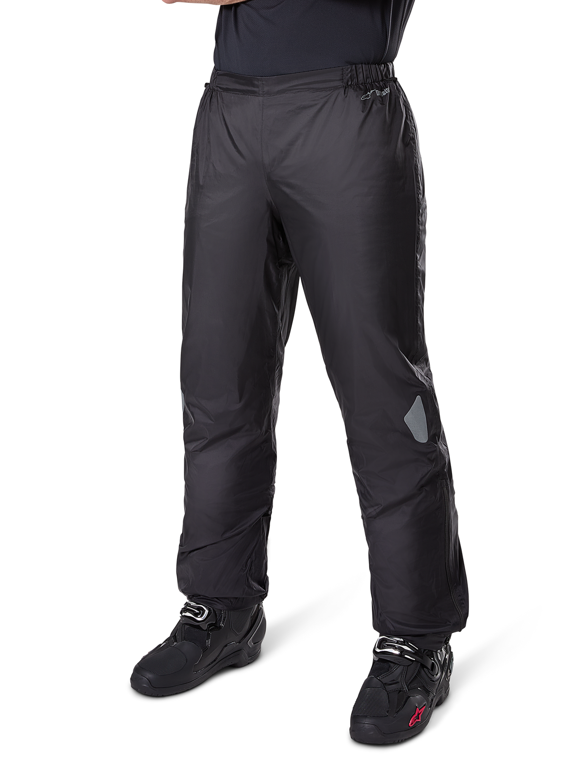 Alpinestars Bogotá Pro Drystar® 3 Seasons Pants, Adventure Touring Motorcycle Pants, Black, worn with black riding boots, featuring reflective patches on the knees and Drystar branding, lightweight waterproof textile design for all-season riding.