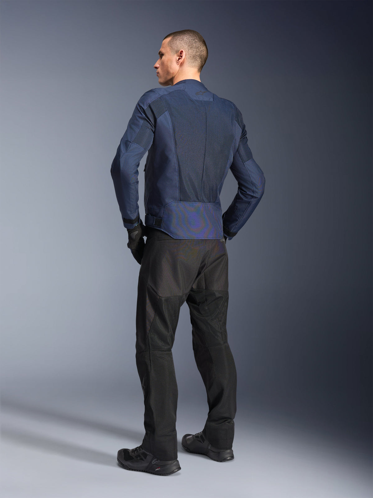 Alpinestars C-1 Air Jacket, Blue urban motorcycle jacket, rear view on man with mesh and reflective details.