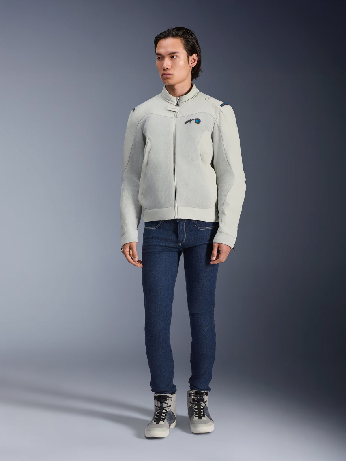 Alpinestars Circal-1 Air Jacket, Metal Gray, urban motorcycle jacket with mesh airflow panels, worn by a model with blue jeans and gray riding sneakers, minimalist design for sustainable city riding.
