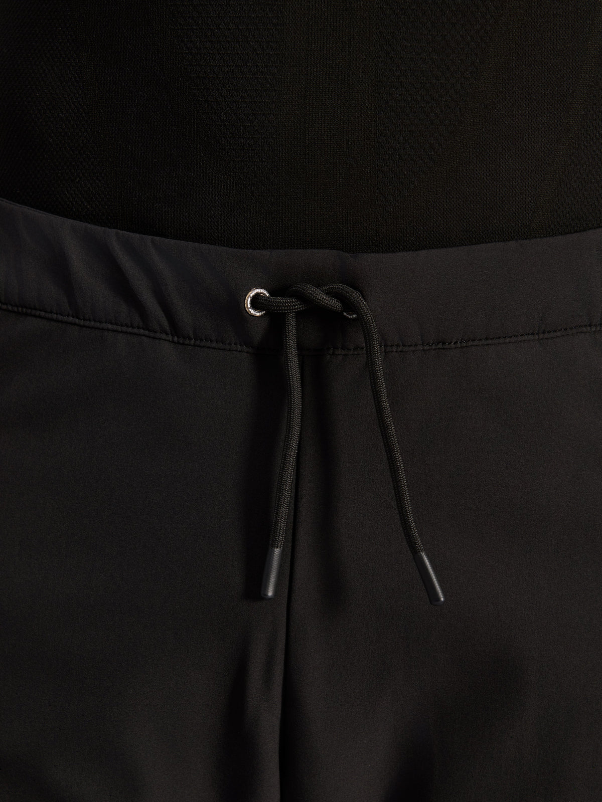 Alpinestars Aeroshell Airflow Pants, Black, close-up of waistband featuring adjustable internal elastic drawstring cord and silver eyelet detail, sport-touring motorcycle gear