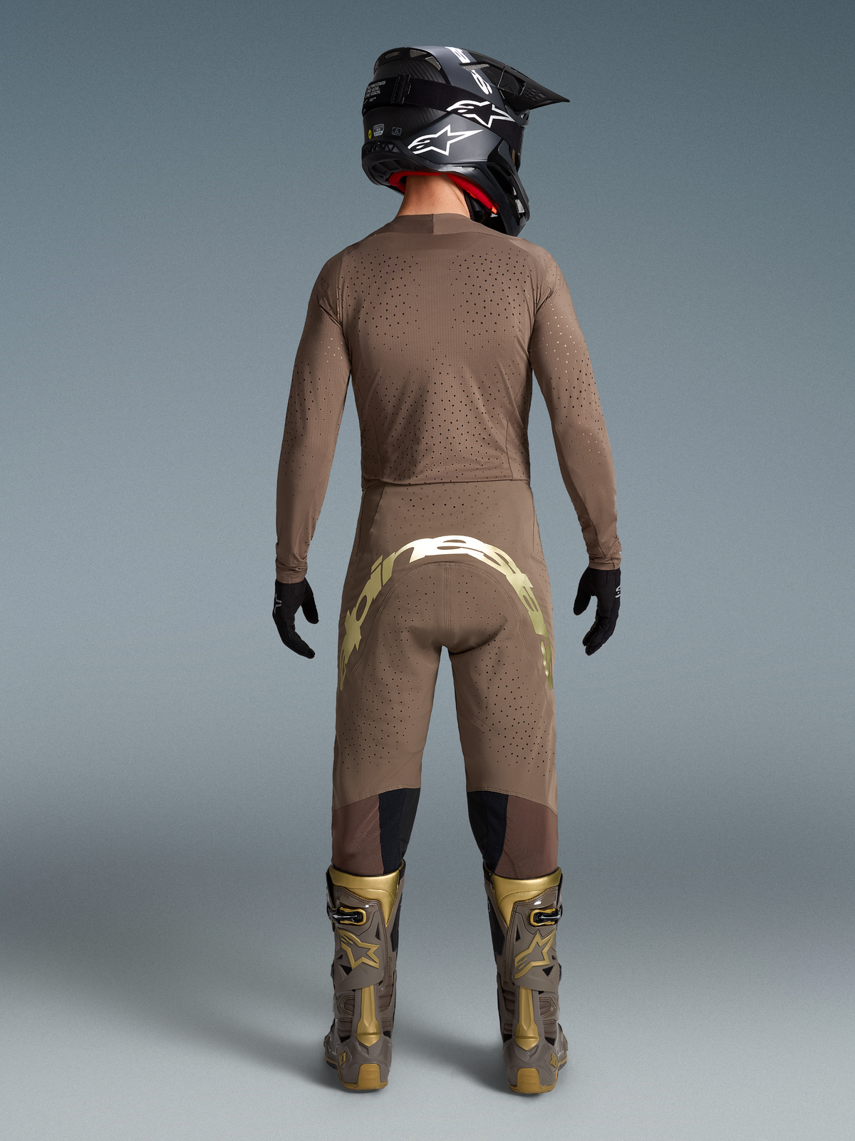 Alpinestars Limited Edition Supertech Air Gold Jersey, Motocross Gear for Men, Earth Brown and Gold, featuring ventilated mesh.