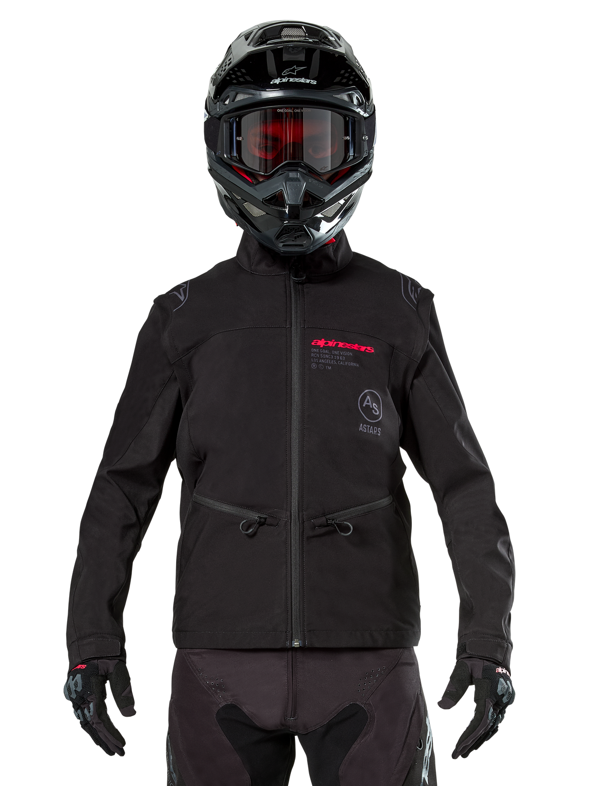 Motocross rider wearing Alpinestars Lite-Dura Softshell Jacket in Black, featuring red and grey logo details on the chest, black helmet with red-tinted goggles, black gloves and pants, front view of technical off-road riding apparel