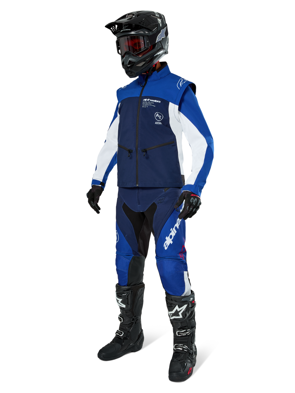 Alpinestars Lite-Dura Softshell Jacket, Navy Bright Blue and White, worn with matching off-road pants, black motocross boots, black helmet with goggles, and black gloves, complete enduro gear for off-road racing