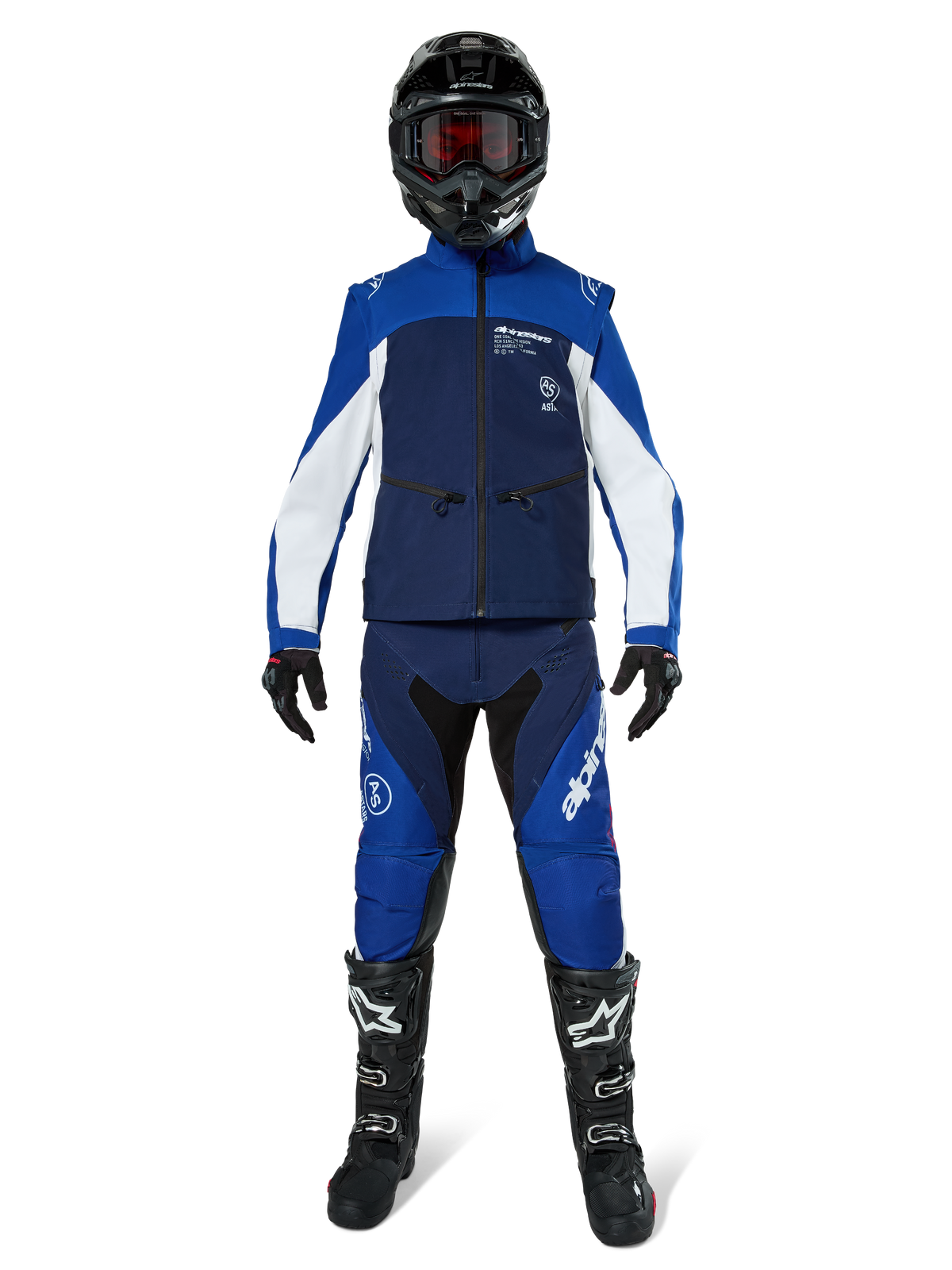 Alpinestars Lite-Dura Softshell Jacket, Off-Road Motorcycle Jacket in Navy, Bright Blue, and White, worn with a matching full gear set including a black helmet, enduro pants, and black boots, technical windproof apparel for dirt bike riding