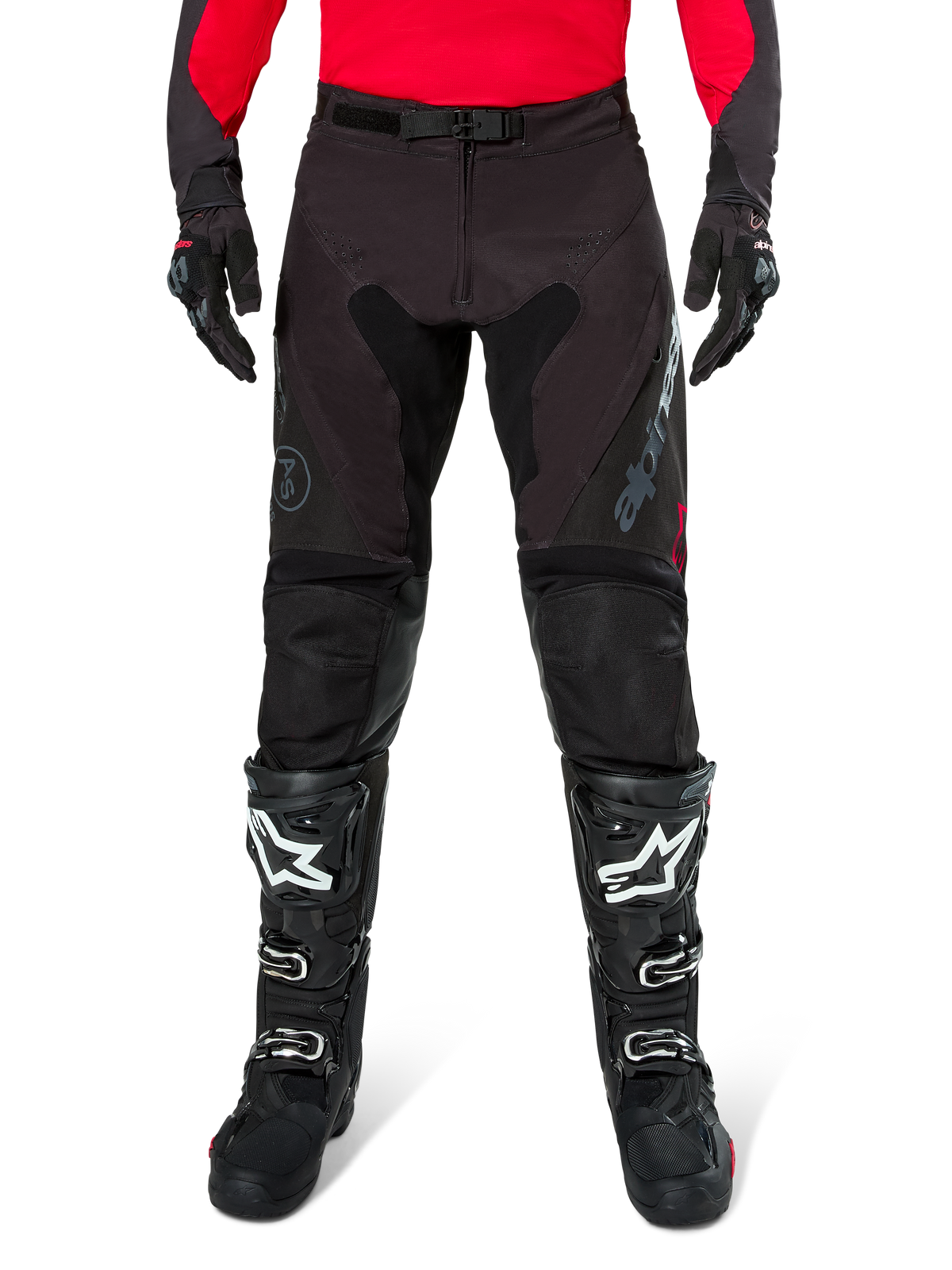 Alpinestars Pro-Dura Pants, Black and Magnet Enduro Pants, worn with a red long-sleeve jersey and black motocross boots, featuring gray Alpinestars branding and durable ripstop construction for off-road riding
