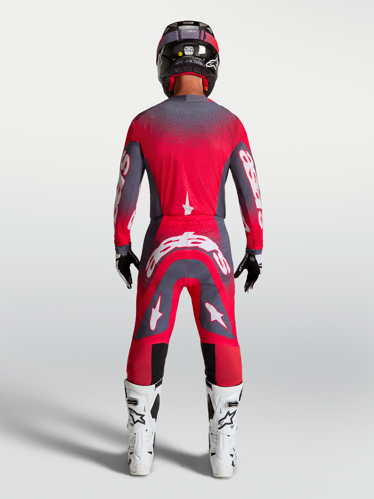 Alpinestars Supertech Hiten AFD Gear Set AND Pants, Motocross Racing Gear, Red Fluo and Graystone, rear view on model.