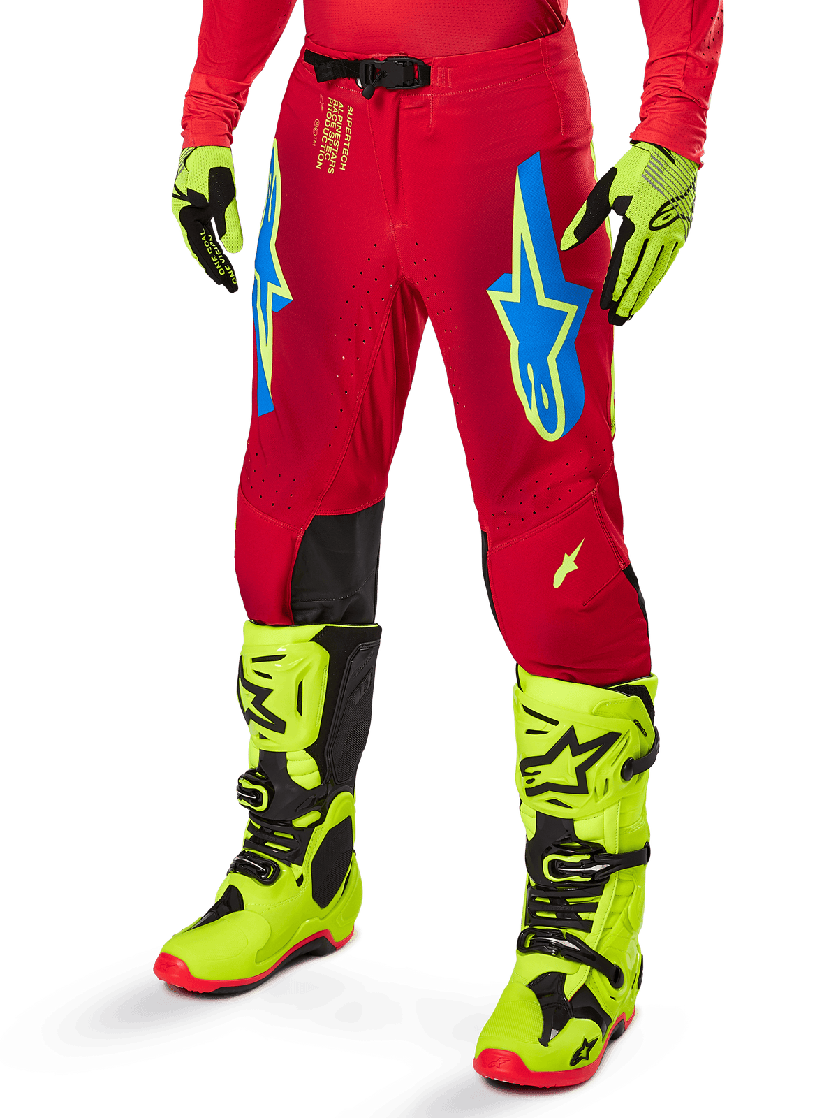 Alpinestars 2025 Supertech Maker Pants, Motocross Racing Pants, Bright Red with blue and yellow star logos, black knee panels, perforated ventilation, coordinated with neon yellow boots and gloves