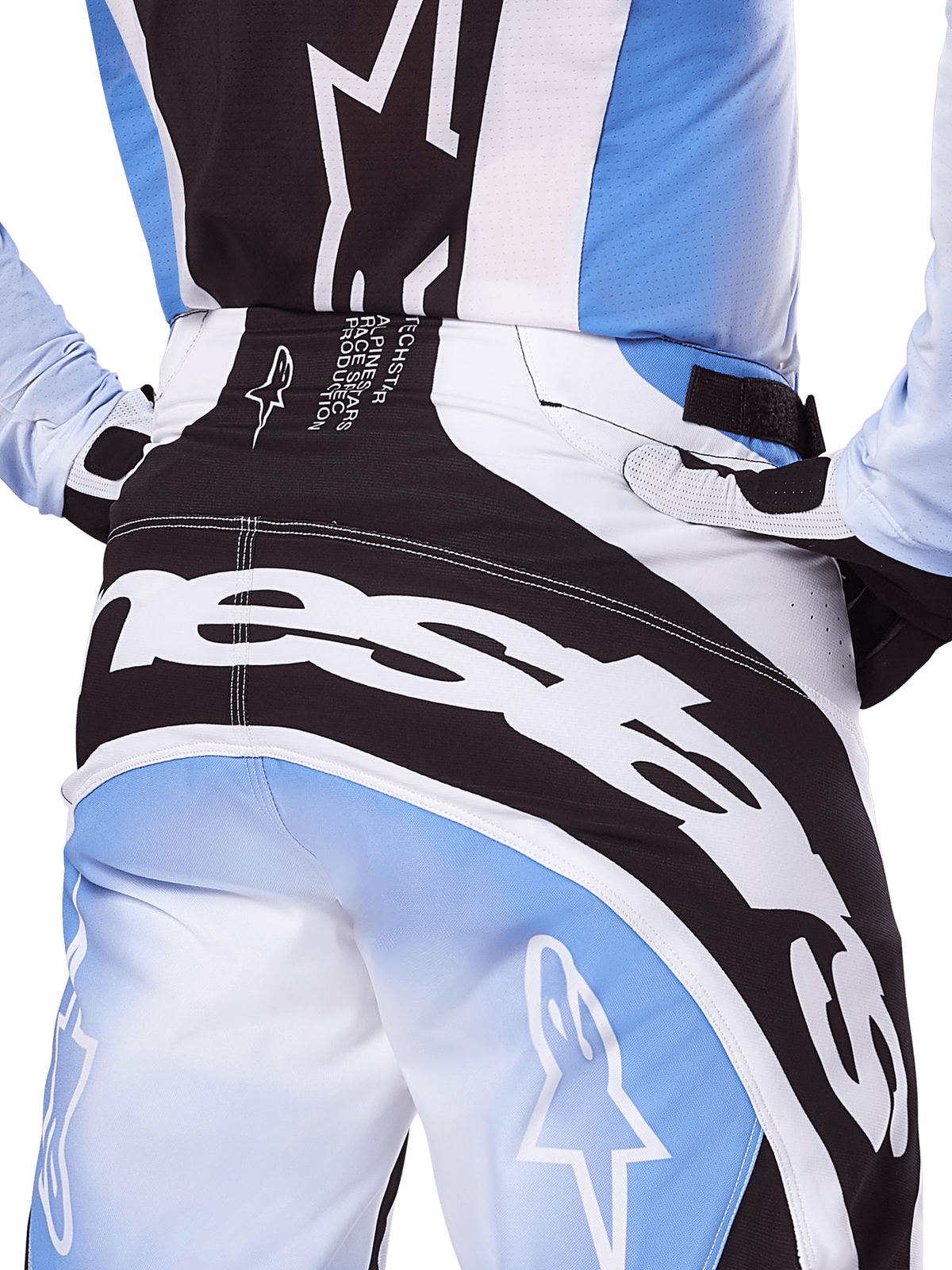 Alpinestars 2025 Techstar Melt Pants, Motocross Pants, Black White and Blue, close-up rear view featuring bold white branding on the seat, coordinated with matching Techstar Melt jersey and gloves, professional racing gear for motocross