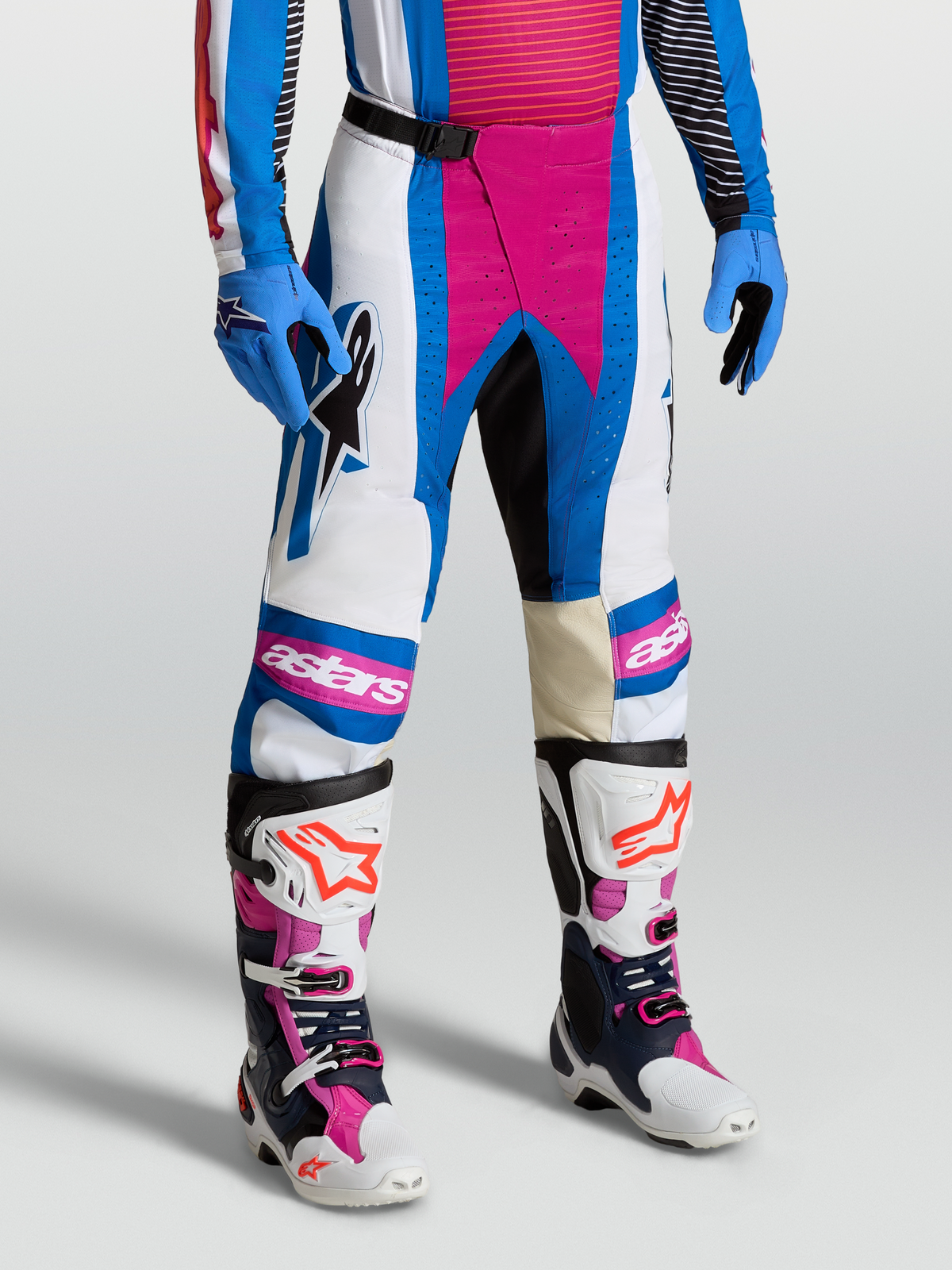 Alpinestars Techstar Maven Pants, Motocross Racing Gear for Men, White and Hot Coral with Blithe Blue accents.