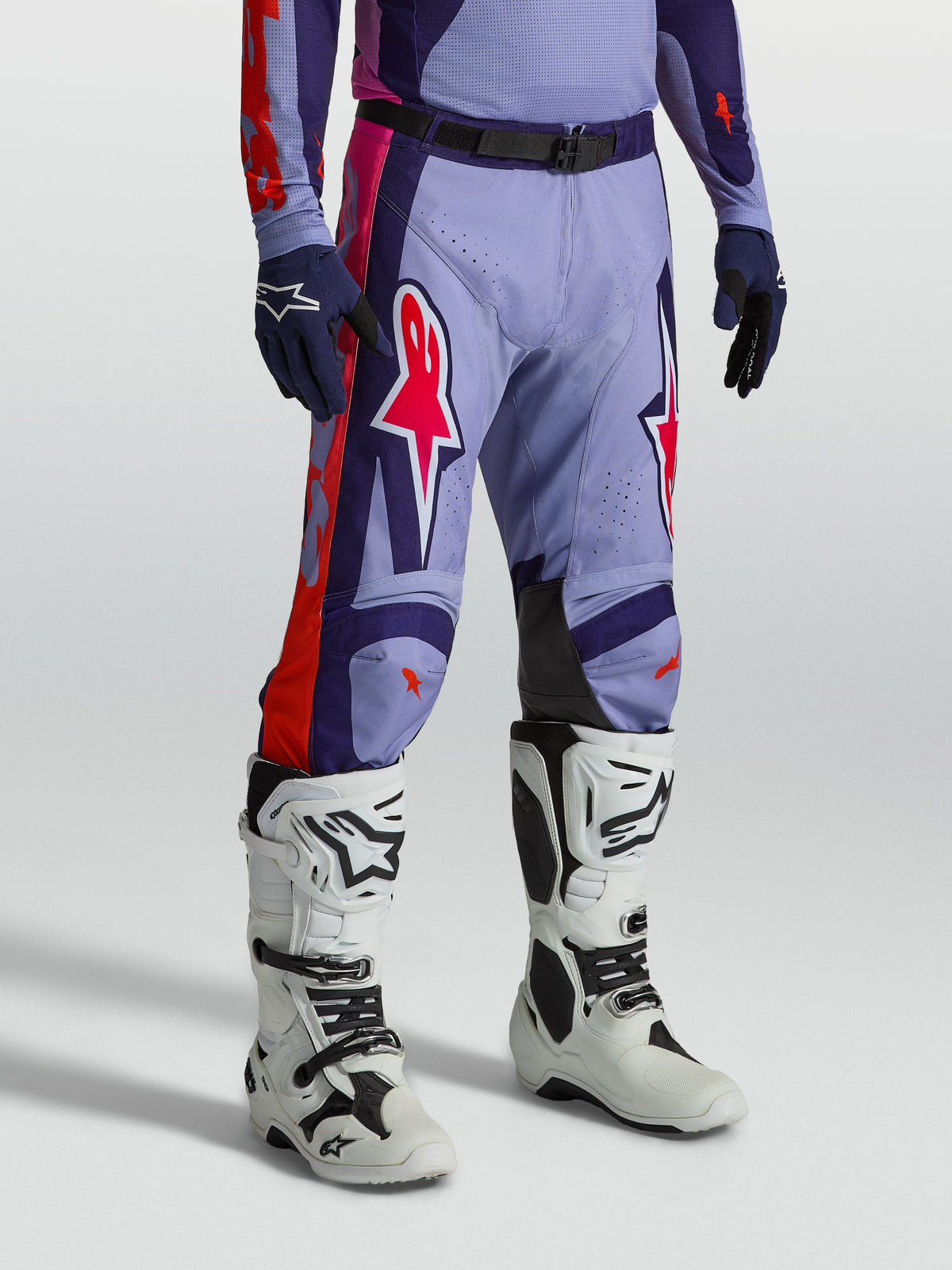 Alpinestars Racer Air Hunt Pants, ventilated purple and pink motocross gear shown on-model with white boots.