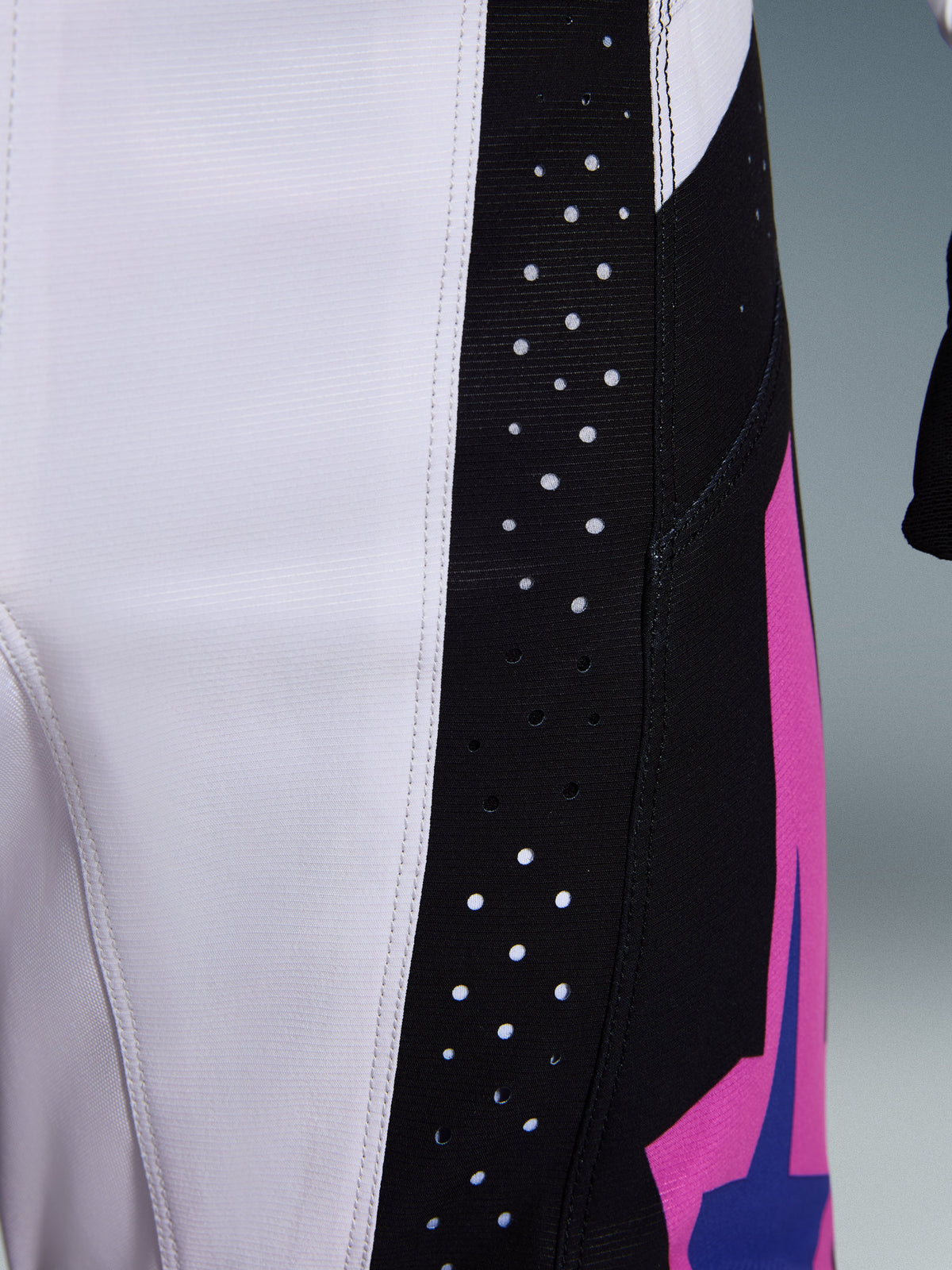 Alpinestars 2026 Techstar Knif Pants, Motocross Pants, Black Light Gray and Purple, close-up detail showing laser-cut perforations on the black side panel for ventilation, durable ripstop fabric construction