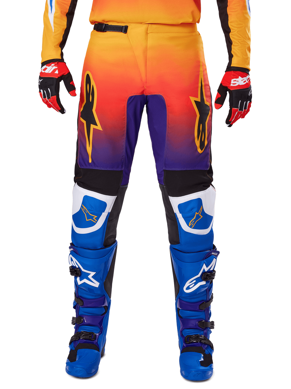 Alpinestars 2025 Fluid Wurx Pants, Motocross Pants, Multicolor featuring orange-to-purple gradient and blue panels, worn with matching blue and purple boots and red and black gloves, front view with star logo branding.
