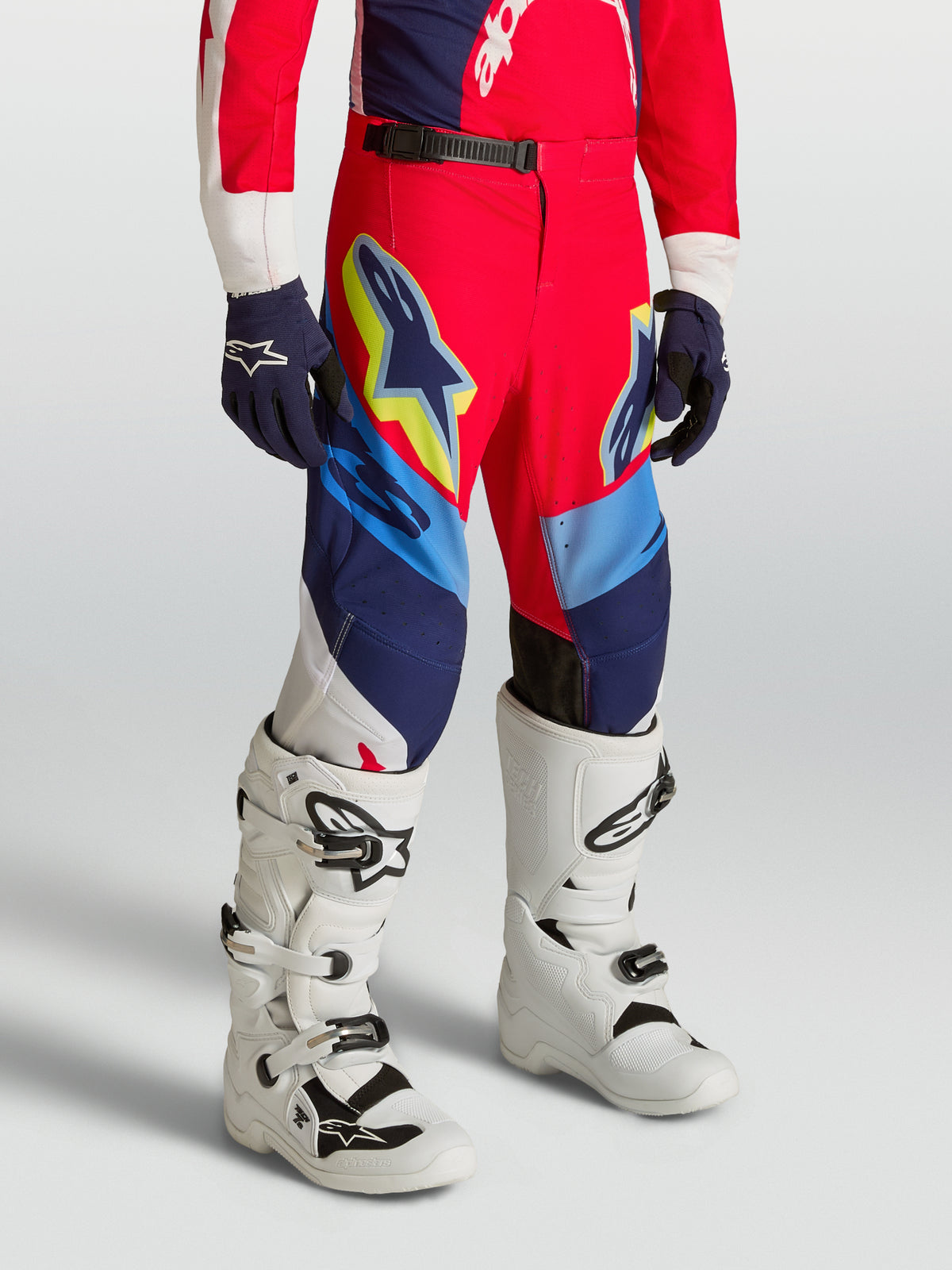 Alpinestars Youth Supertech Dyna Pants, red and navy blue motocross racing gear with stretch rip-stop fabric.
