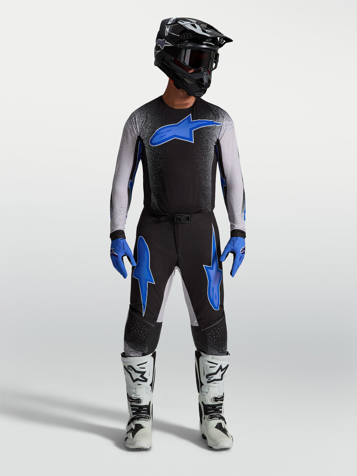 Alpinestars Supertech Hiten AFD Jersey and Gear Set, black and blue men's motocross racing apparel with ergonomic fit.