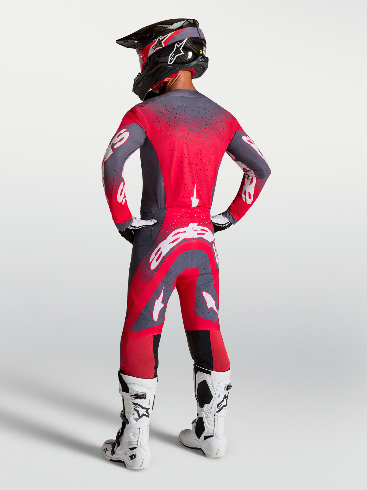 Alpinestars Supertech Hiten AFD Jersey and Gear Set, Red Fluo and Graystone Motocross Outfit, on-model rear view.