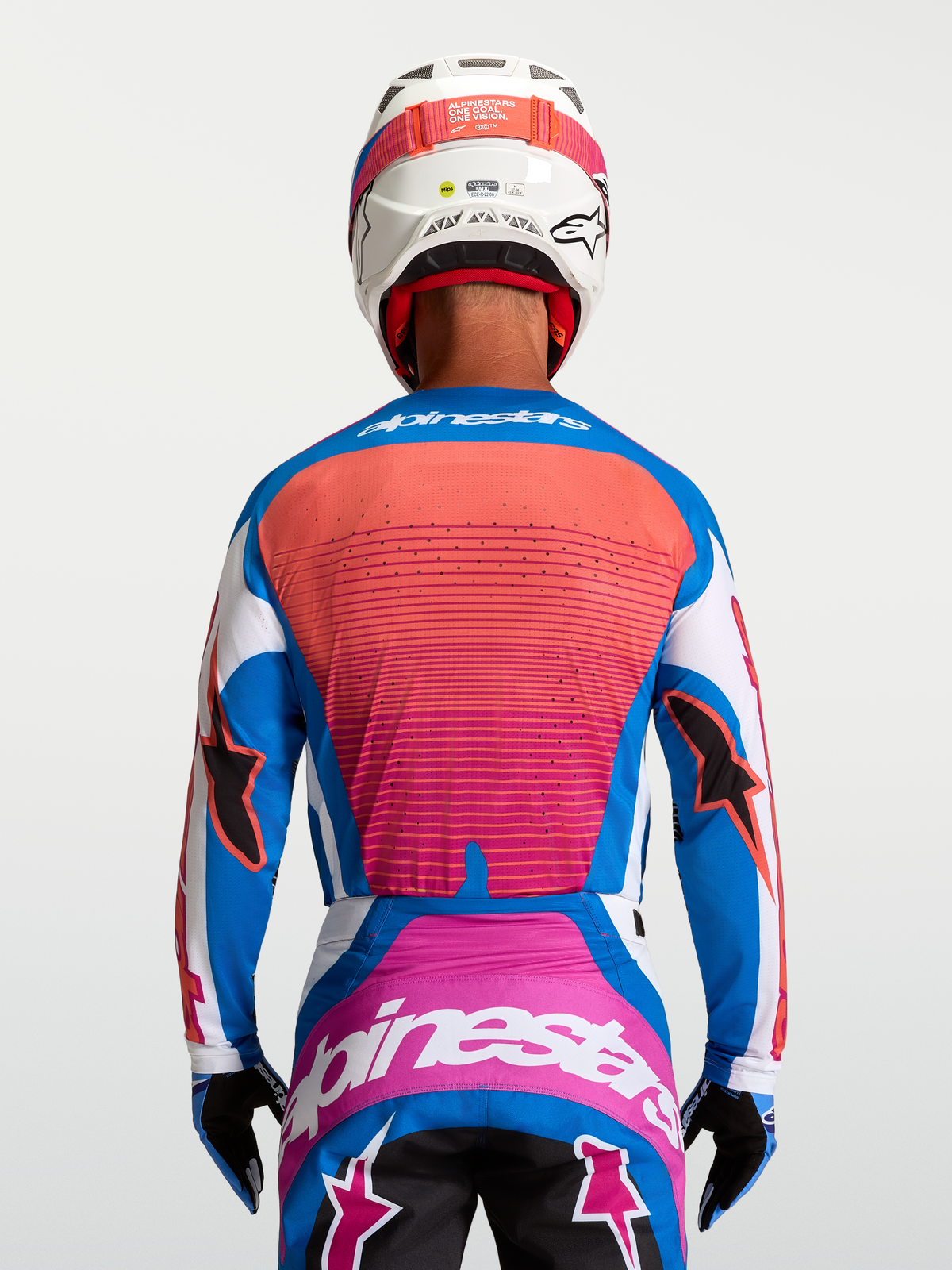 Alpinestars Techstar Maven Jersey, back view on rider, Blithe Blue and Hot Coral, athletic motocross fit with ventilation.