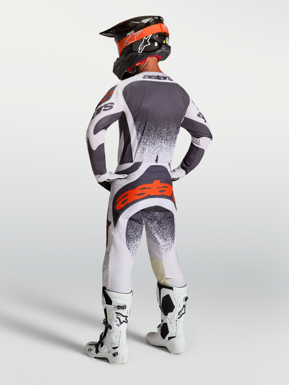 Alpinestars Techstar Swan Jersey AND Gear Set, men's motocross racing outfit in dark gray and red fluo.