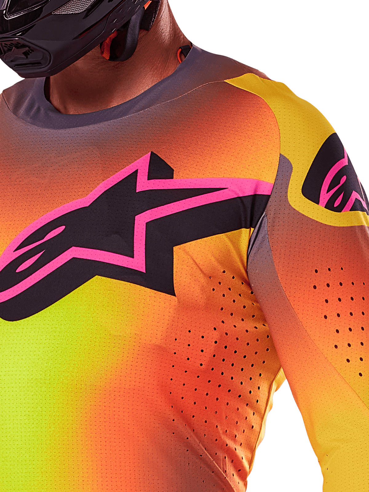 Close-up of the Alpinestars 2025 Supertech Lipan Jersey in Yellow Pink, featuring a vibrant gradient design, a large black star logo with a pink border on the chest, and visible laser-cut perforations for enhanced airflow.