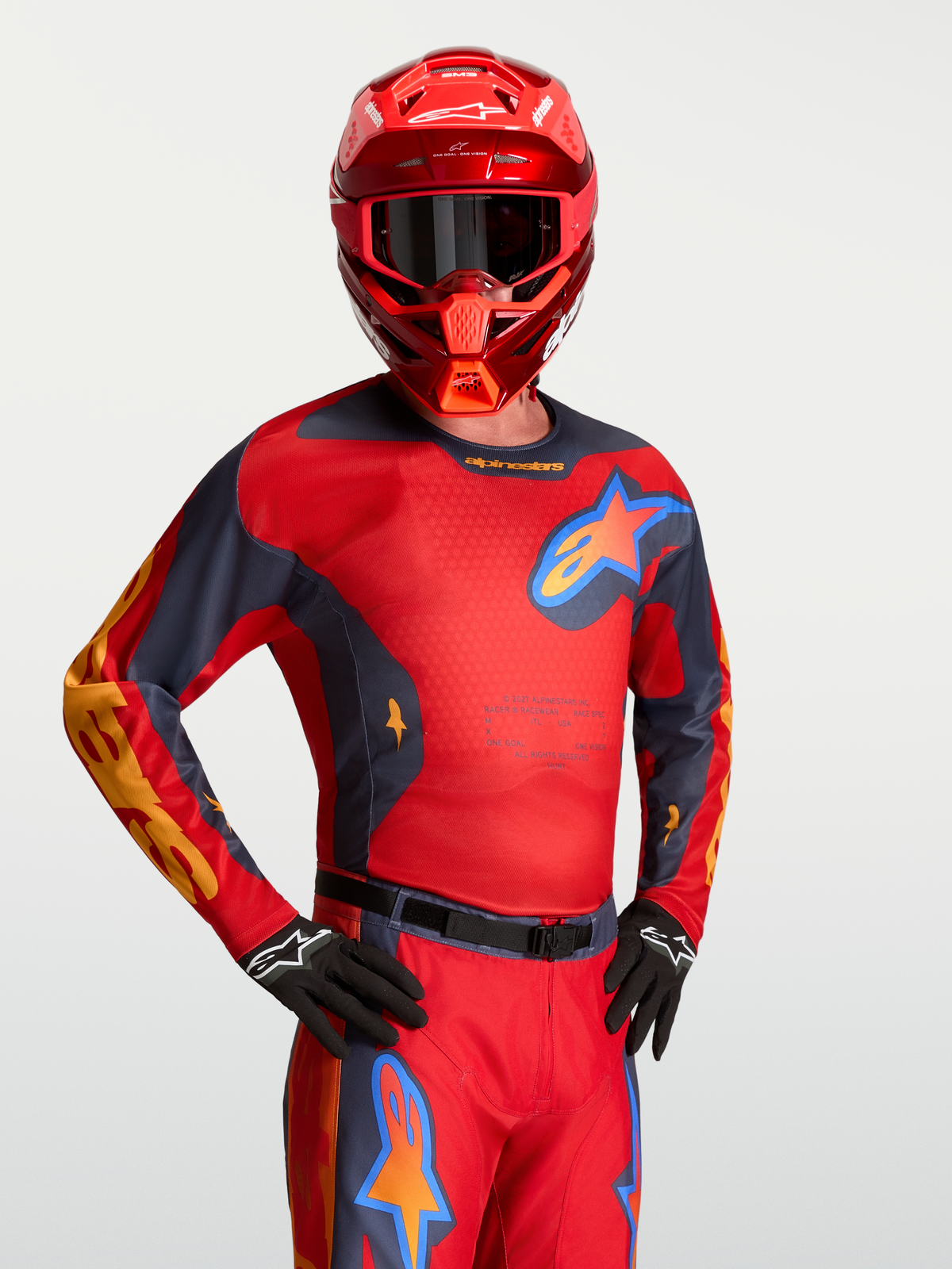 Alpinestars 2027 Racer Hunt Jersey, red and graystone men's motocross jersey with moisture-wicking polyfabric on-model.