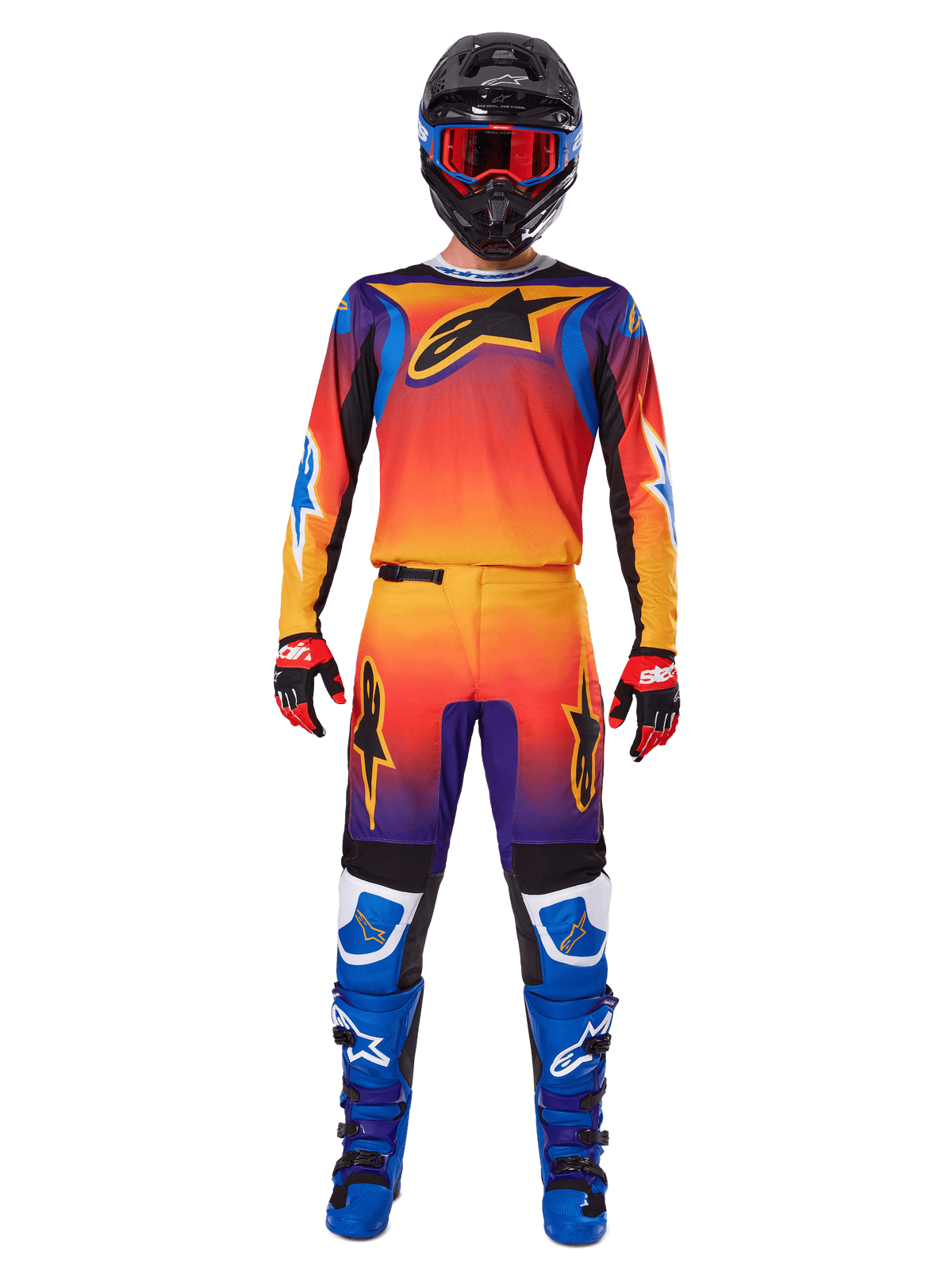 Motocross rider wearing the Alpinestars 2025 Fluid Wurx Gear Set, featuring a vibrant orange, yellow, and blue gradient on the jersey and pants, black Alpinestars logos, paired with blue racing boots, red and black gloves, and a black helmet with red goggles, complete coordinated outfit for off-road racing