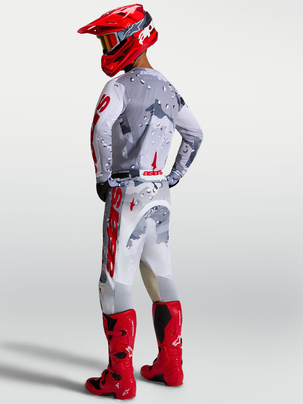 Alpinestars Racer Air Lone Jersey, Gray Camo and Fire Red motocross gear set with breathable mesh construction.