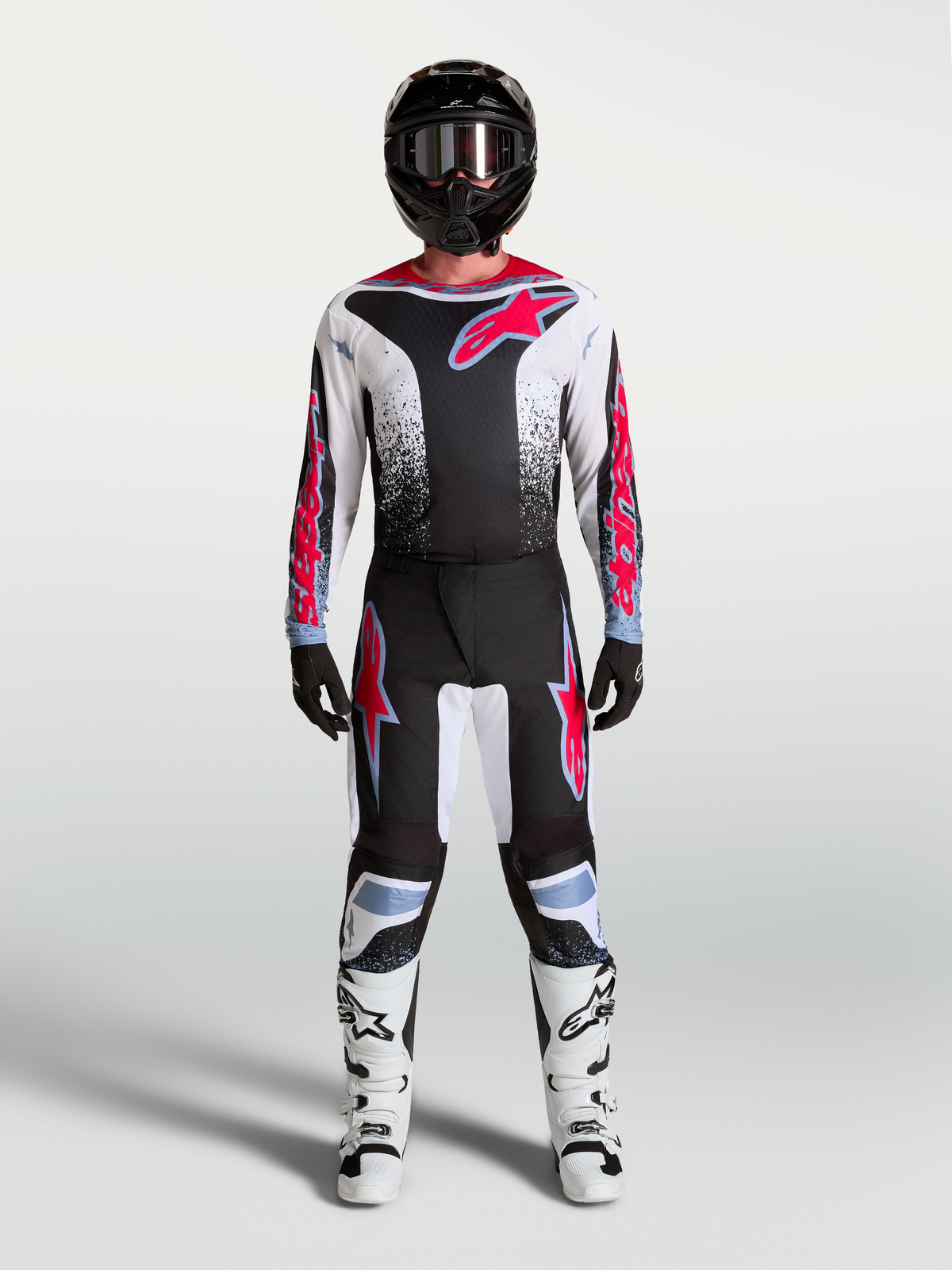 Alpinestars Fluid Drag Jersey and Gear Set, black and white motocross kit with red graphics for off-road performance.