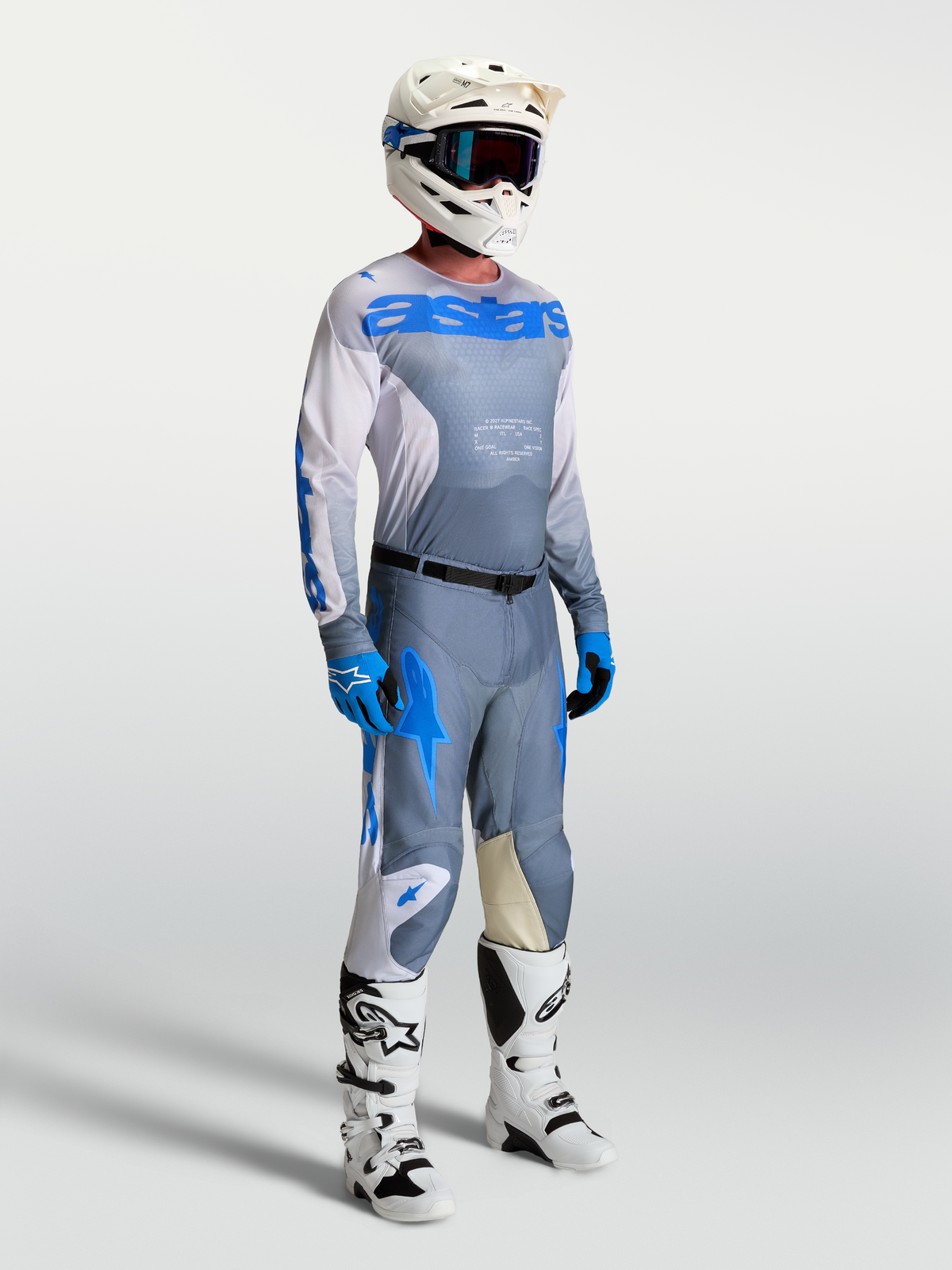 Alpinestars 2027 Racer Amber Jersey, Men's Motocross gear in Ash Gray and UCLA Blue with breathable mesh and matching pants.