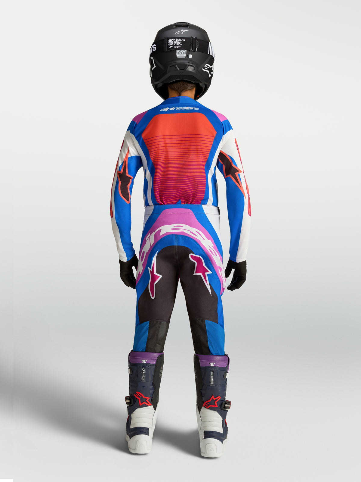 Alpinestars Youth Supertech Maven Motocross Gear Set, Blue and Hot Coral racing jersey and pants, rear view on model.